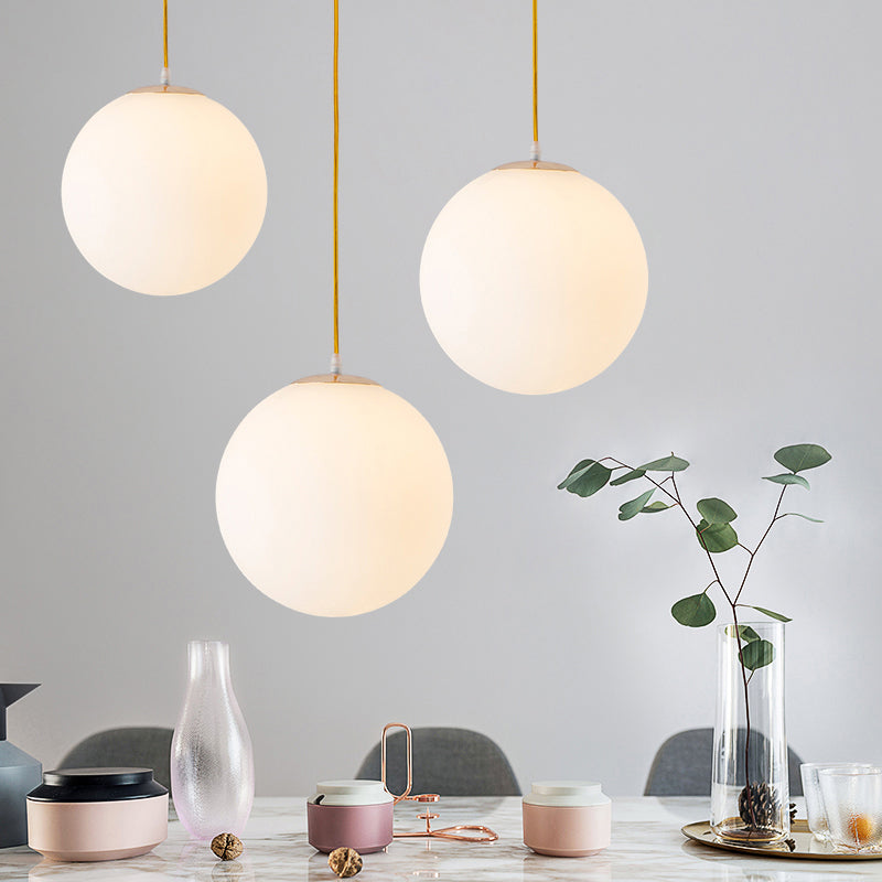 Globe Milky Glass Hanging Lamp Minimalistic 1-Light Gold Pendant Light for Dining Room Clearhalo 'Ceiling Lights' 'Modern Pendants' 'Modern' 'Pendant Lights' 'Pendants' Lighting' 2356906