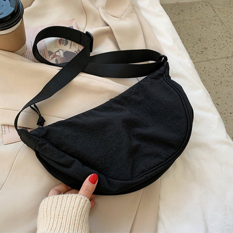 Crescent-shaped Crossbody Bag | Durable Polyester | Adjustable Strap | Compact & Organized Storage