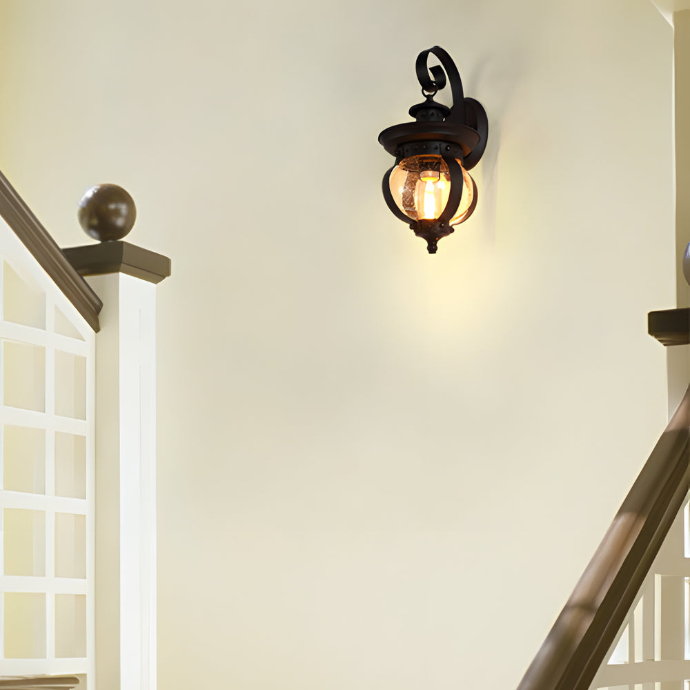 1-Light Black Outdoor Wall Lantern with Curved Arm and Seeded Glass Globe LED by Taavita