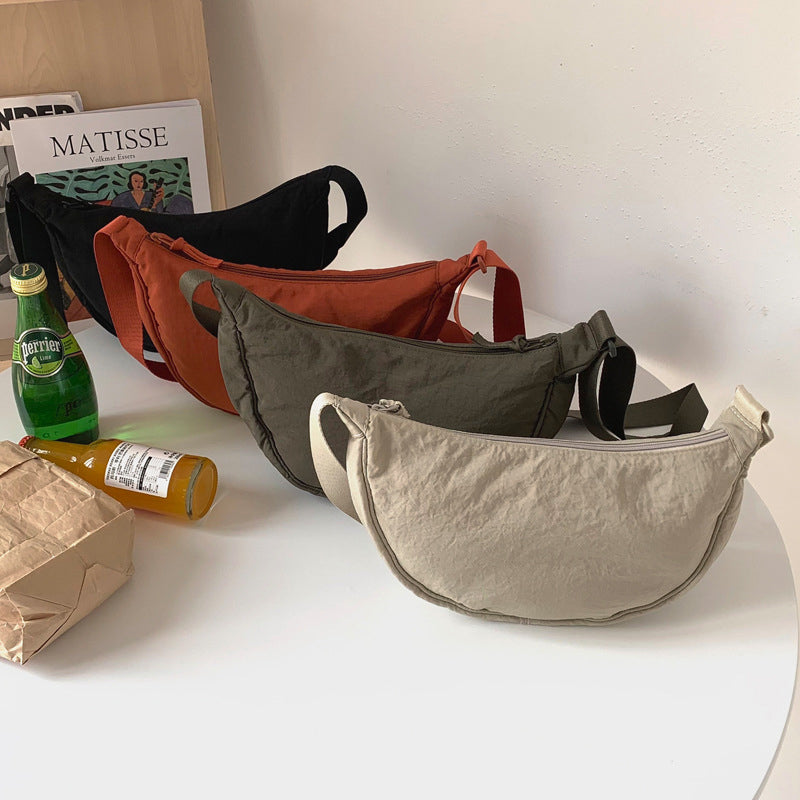 Crescent-shaped Crossbody Bag | Durable Polyester | Adjustable Strap | Compact & Organized Storage