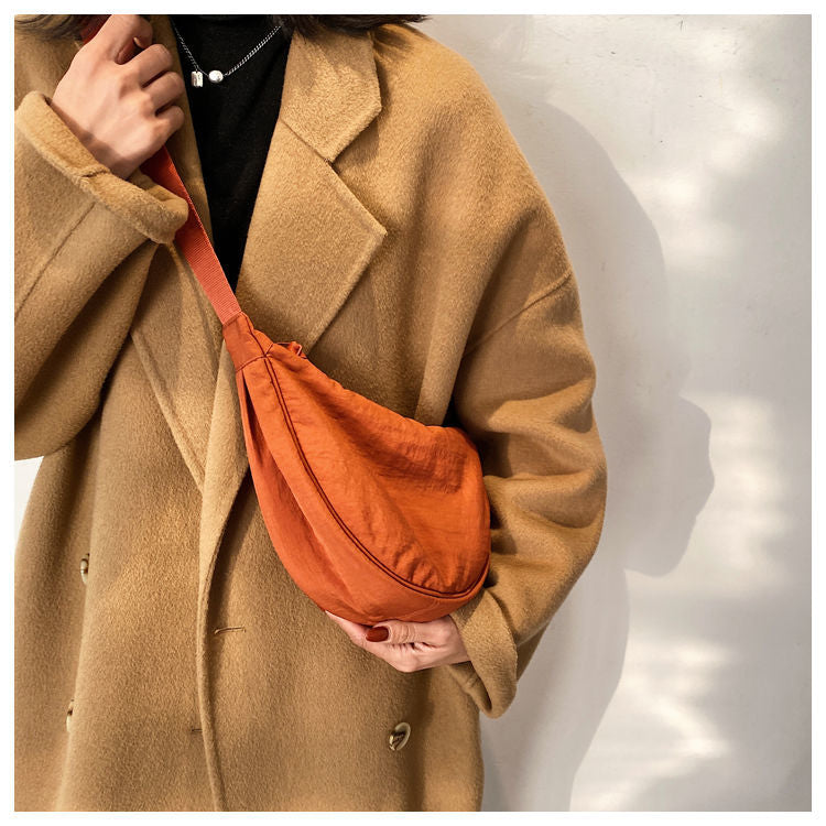Crescent-shaped Crossbody Bag | Durable Polyester | Adjustable Strap | Compact & Organized Storage