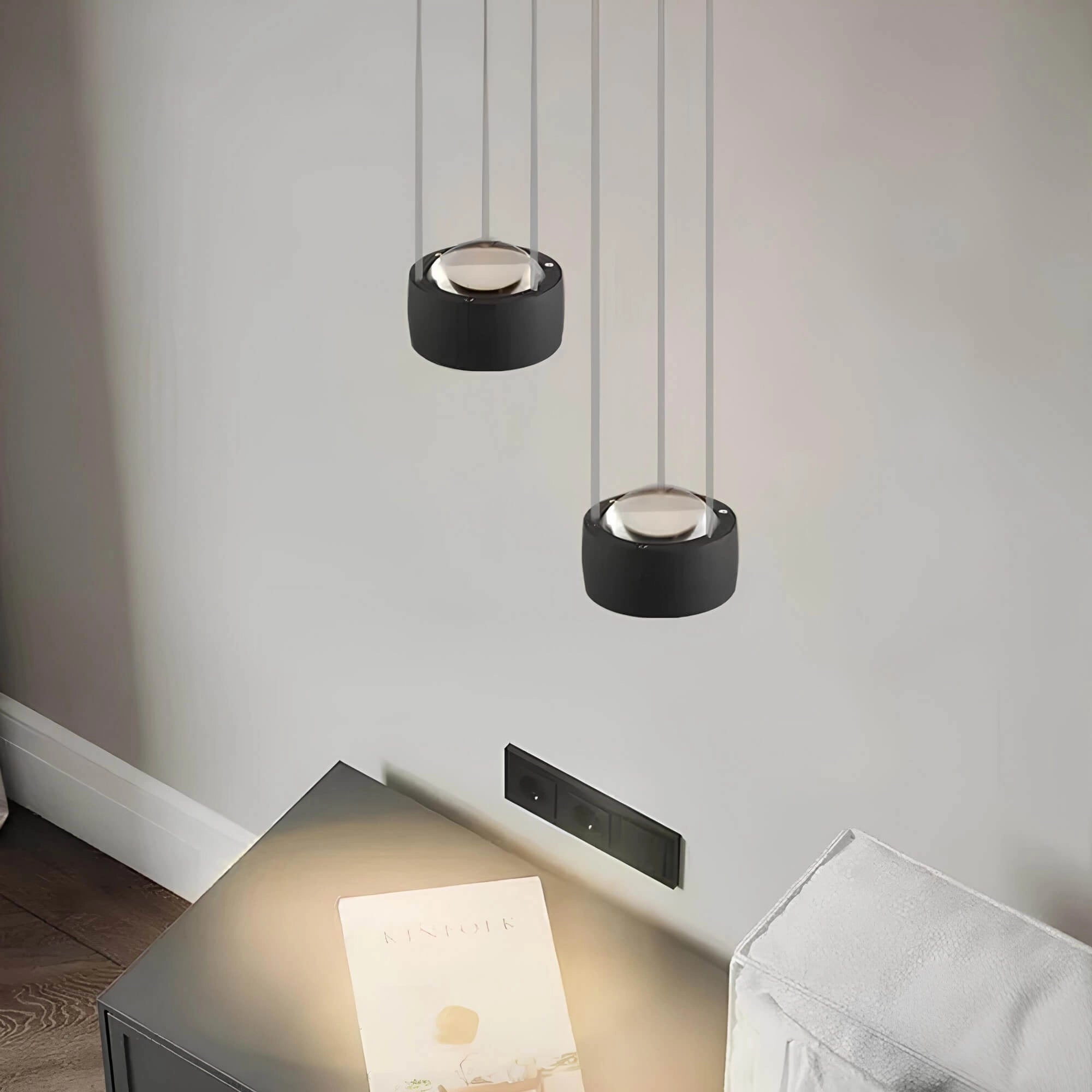 Modern rectangular LED pendant light in black with a minimalist design, featuring adjustable suspension for ceiling installation, suitable for contemporary rooms.