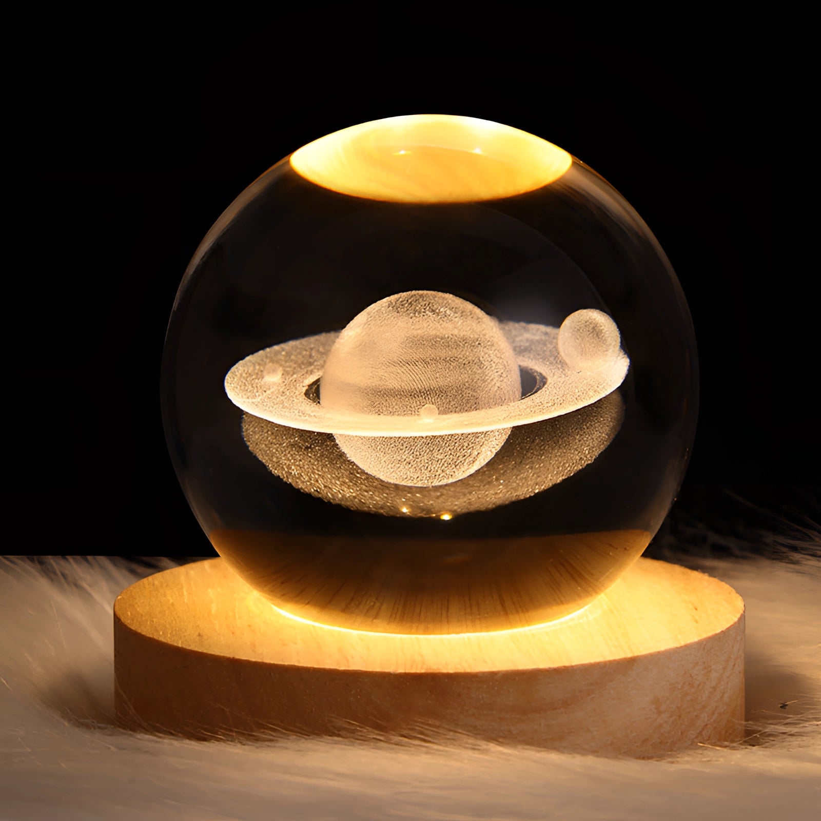 3D crystal ball LED light featuring a laser-engraved design of the planet Saturn, measuring 6 cm in diameter, with intricate planetary details and a glowing effect.