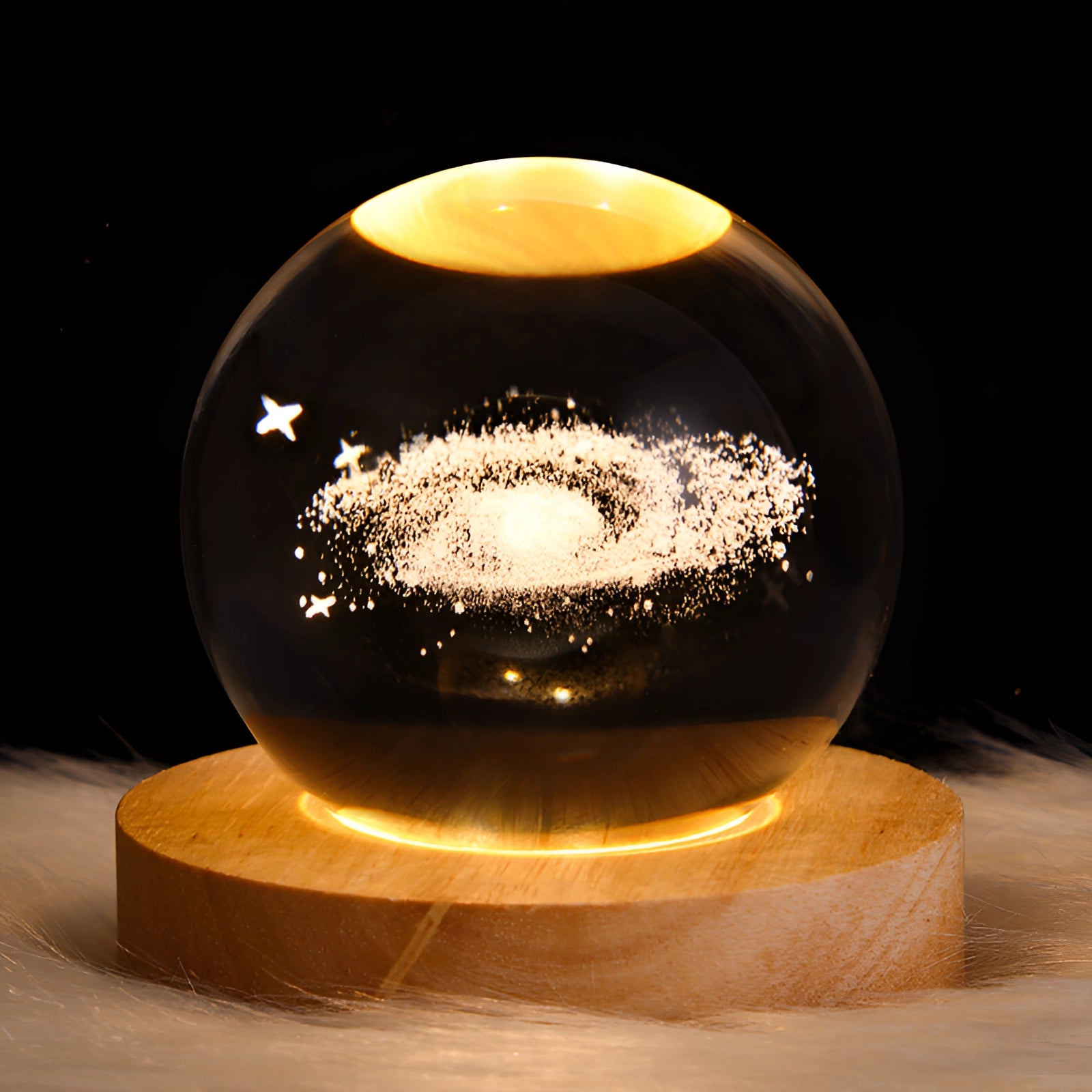 3D Crystal Ball LED Light with Laser Engraved Galaxy and Planetary Designs, featuring a foggy finish on a 6 cm crystal sphere, illuminated to highlight intricate celestial patterns.
