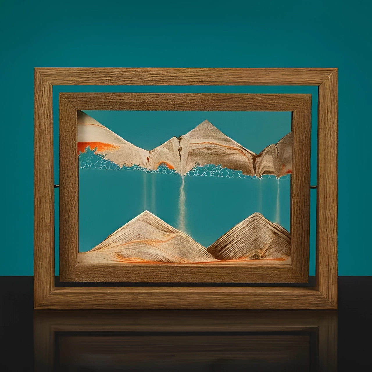 3D Kinetic Sand Art Picture Frame in Aqua Blue with a rotating brown wooden frame, featuring a rectangular landscape design with intricate patterns and shades, ideal for desktop display.