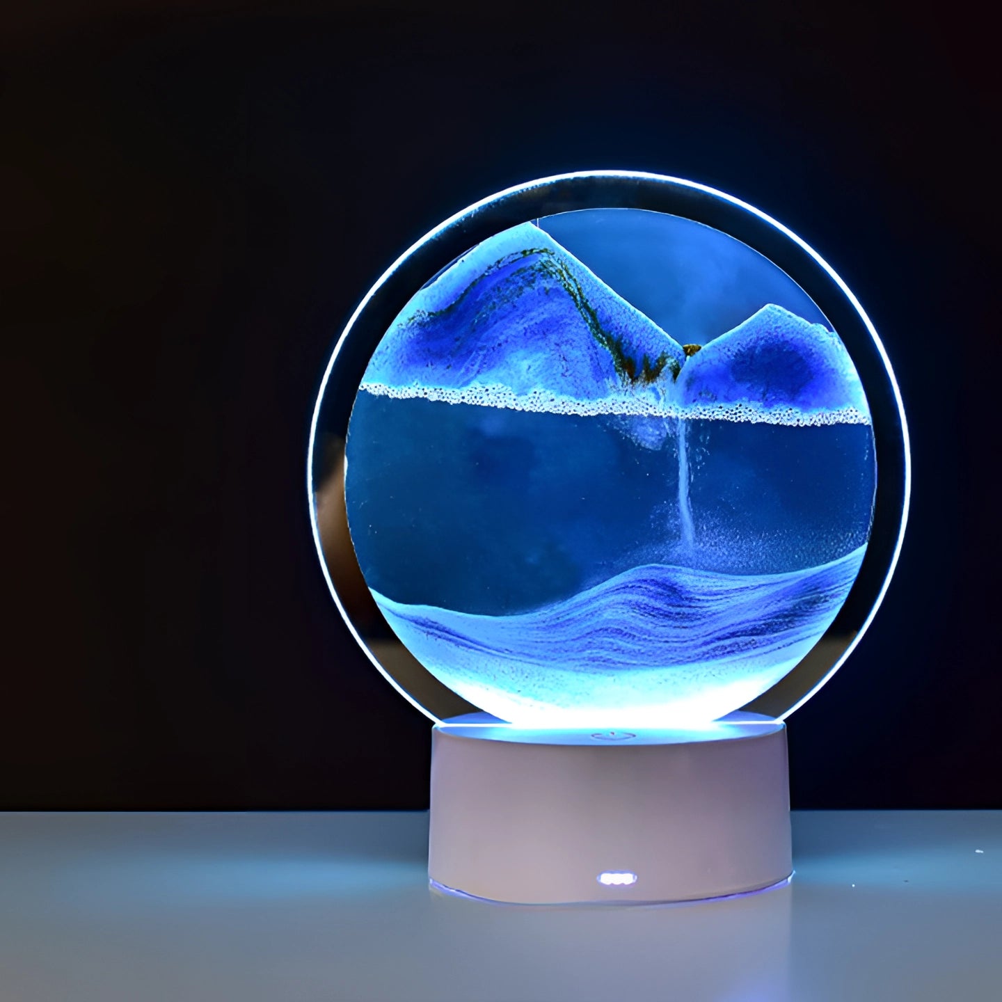 3D LED Sand Art Night Light Lamp featuring a resin mountain design with electric blue LED lighting, showcasing a circular display resembling an astronomical object, surrounded by transparent materials for a captivating art piece.