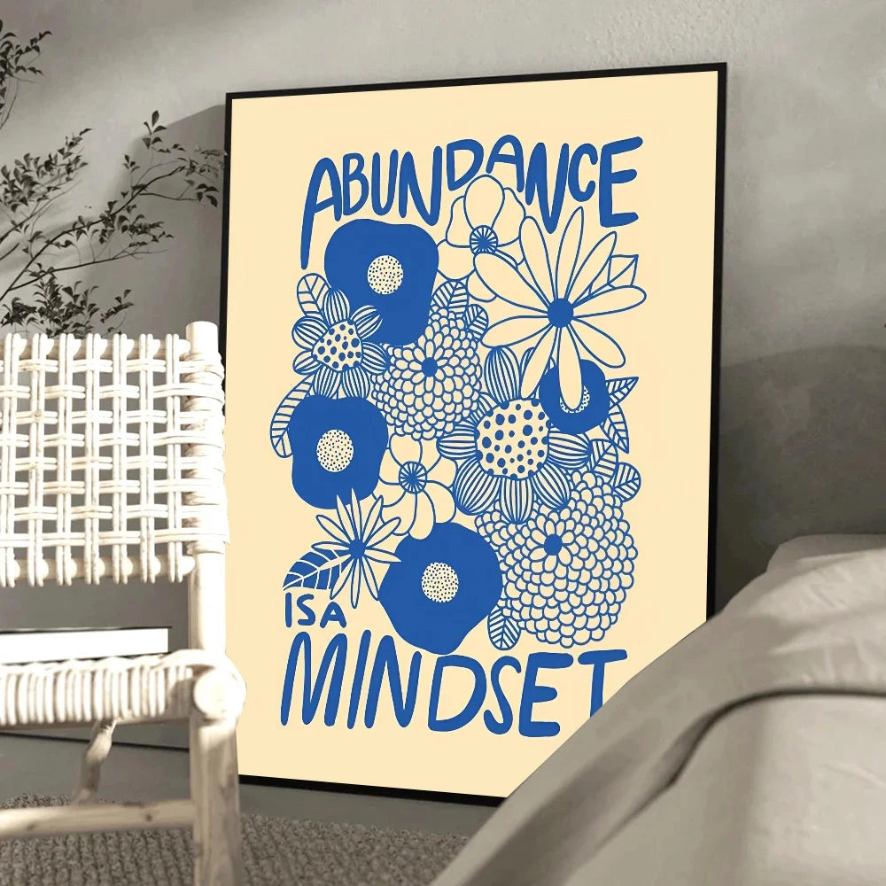 Blue and yellow floral art motivational poster with the phrase "Abundance Mindset" prominently displayed in stylish font; features a rectangular design and plant-inspired patterns, suitable for wall decoration.