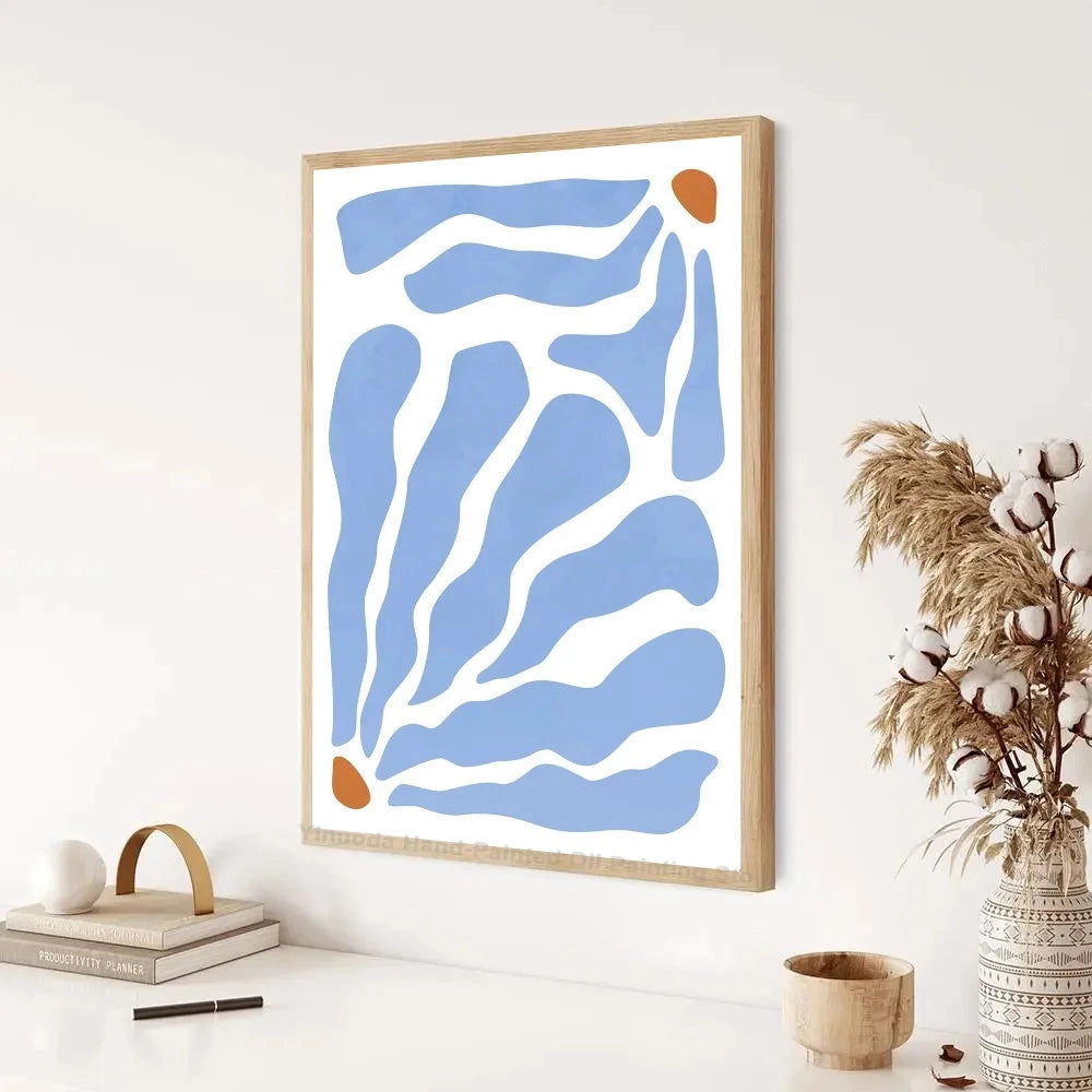 Abundance Mindset Motivational Poster with blue and yellow floral art in a rectangular frame, displayed on a wall with an interior design theme.