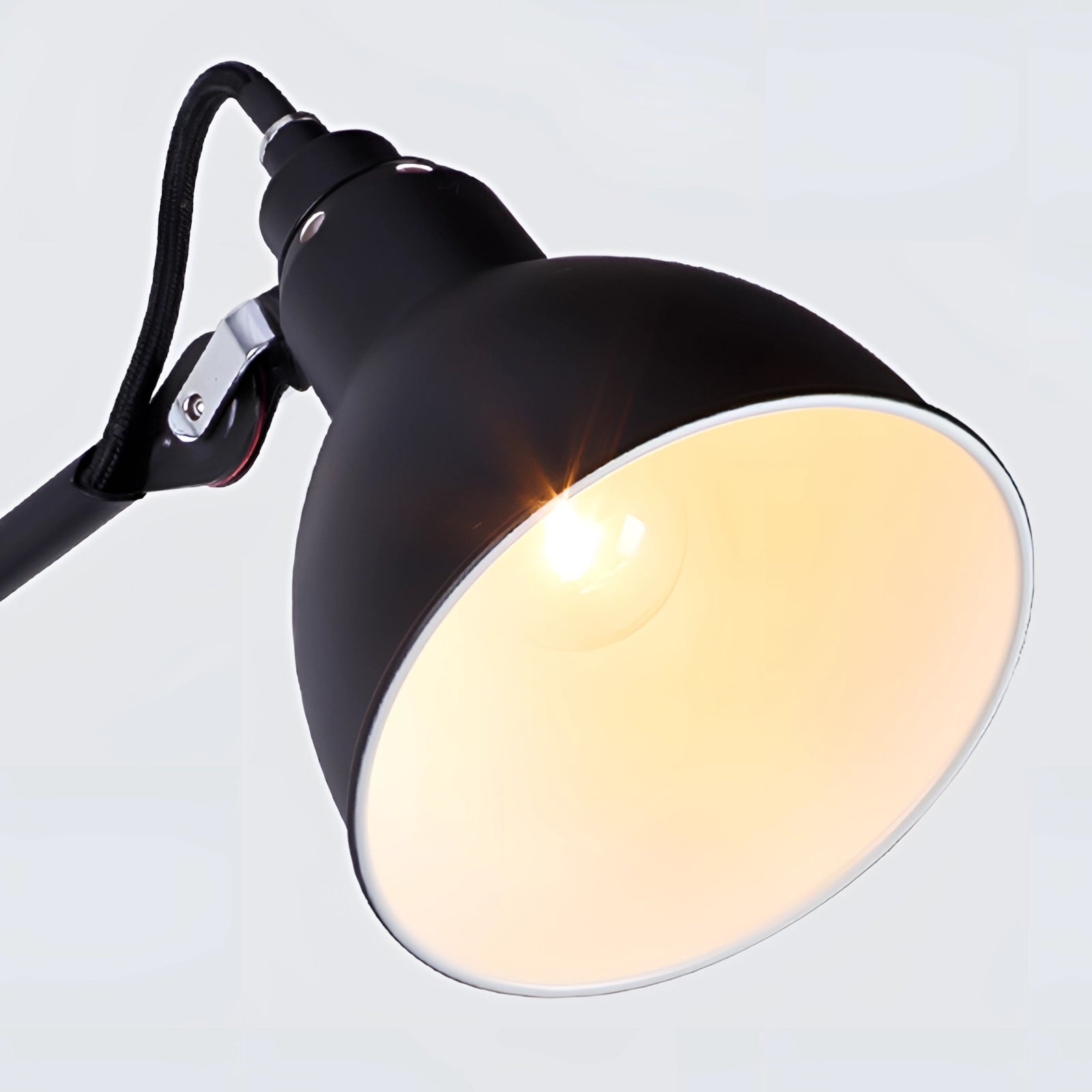 Adjustable black metal wall lamp designed in an industrial style, featuring an LED sconce for modern lighting.