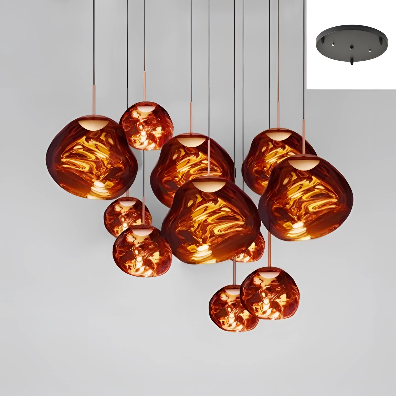 Amber glass triple pendant light fixture with a modern copper design, featuring 11 heads in varying sizes and a striking red finish, suspended from a ceiling mount.