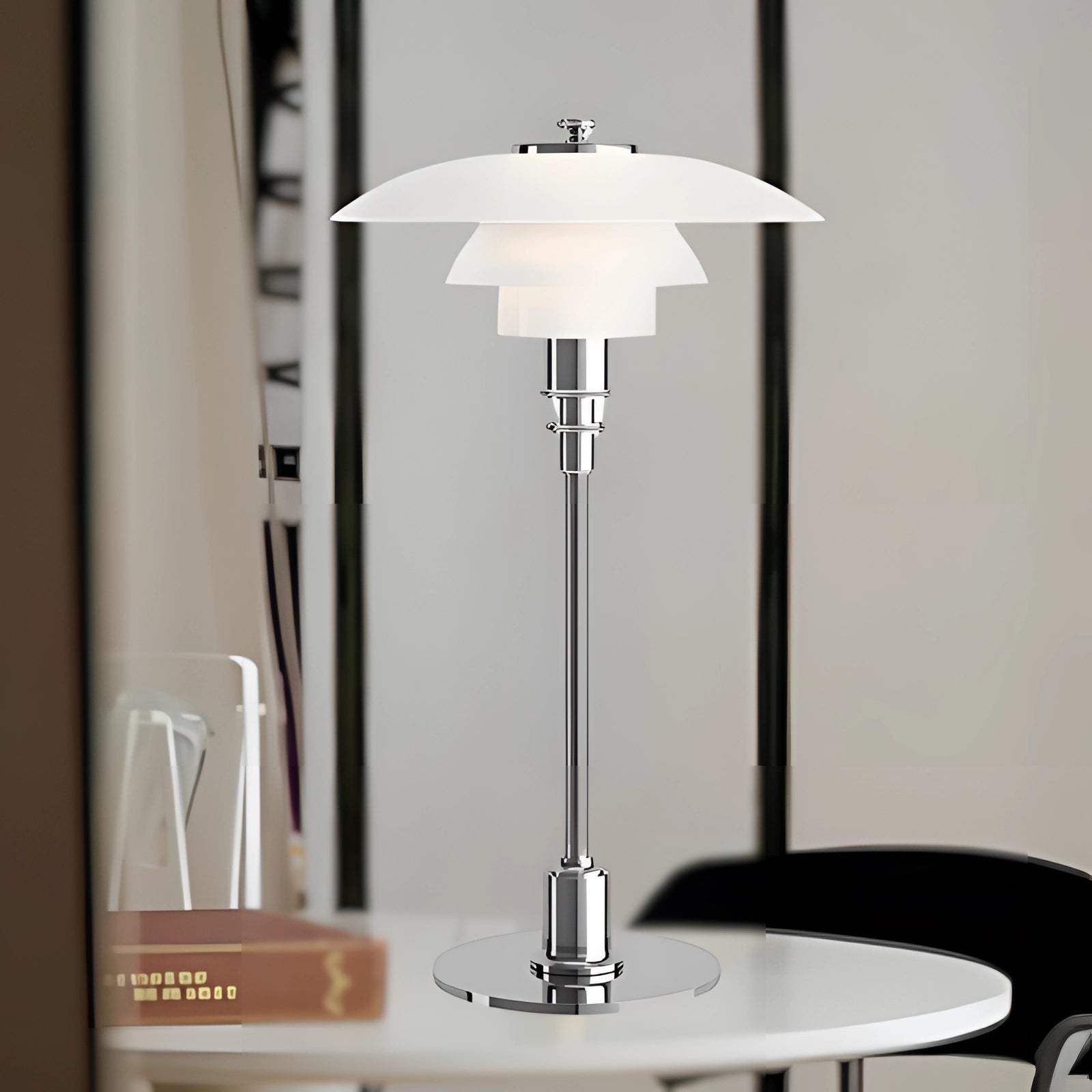 Art-Deco orange glass table lamp with vintage brass accents and a white silver lampshade, suitable for a home office setting.