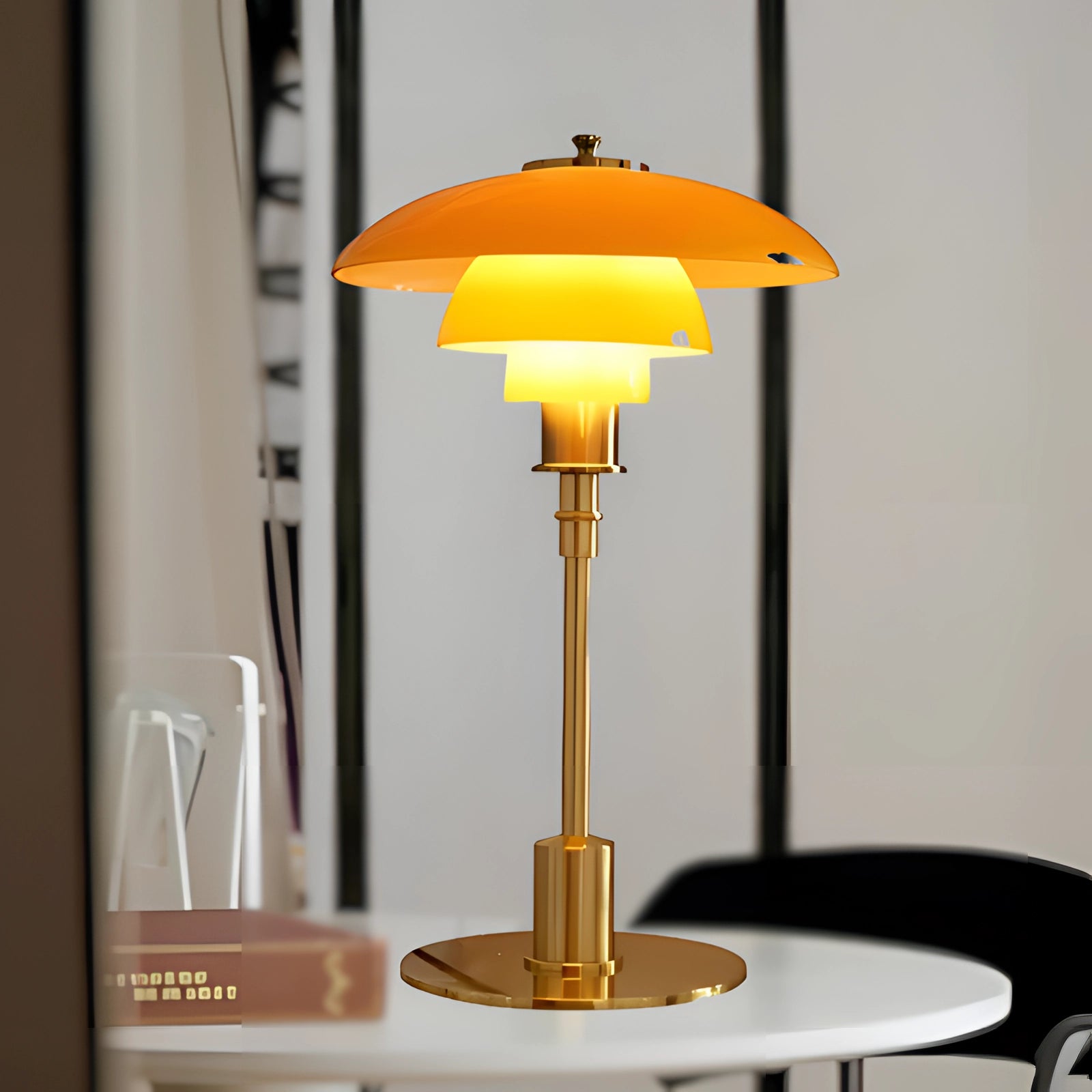 Art-Deco orange glass table lamp with a vintage brass base and a yellow lampshade, suitable for home office decor, in the Bernstein-Gold variant.