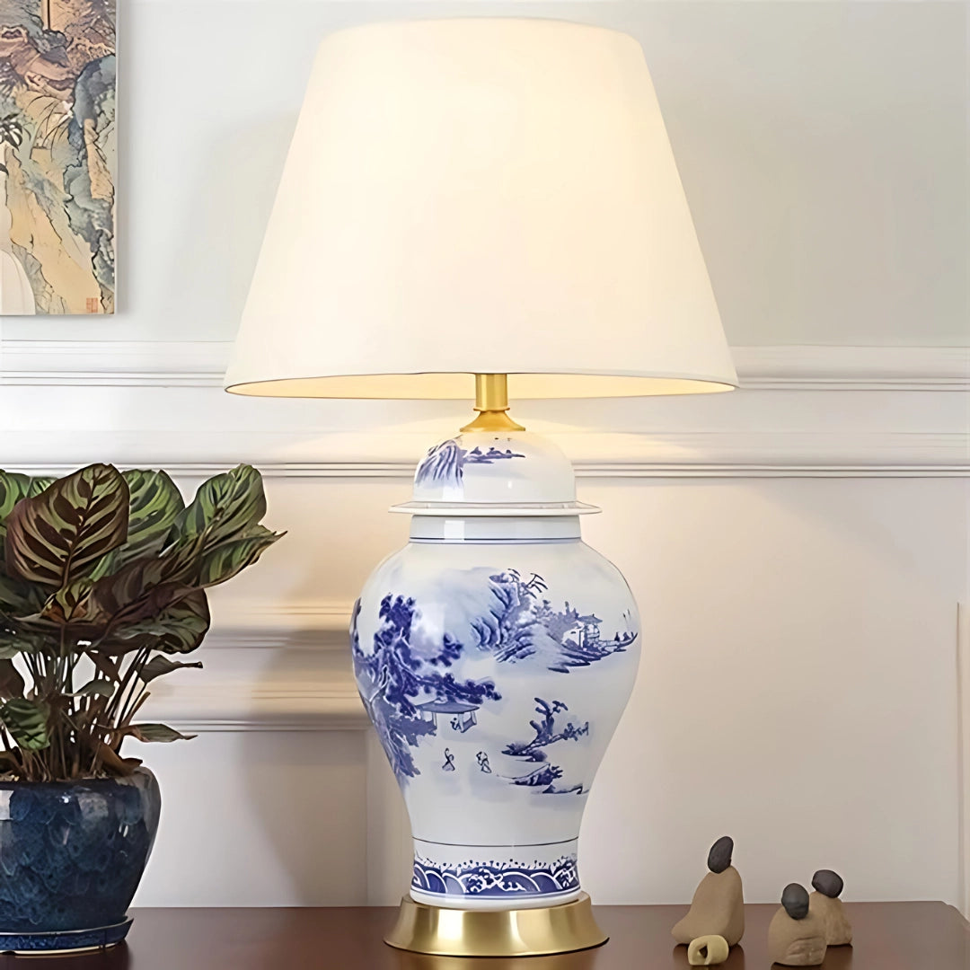 Blue and white porcelain table lamp with elegant Chinese ceramic design, featuring a cold white lampshade, set on a wooden base, ideal for luxury interior decor.