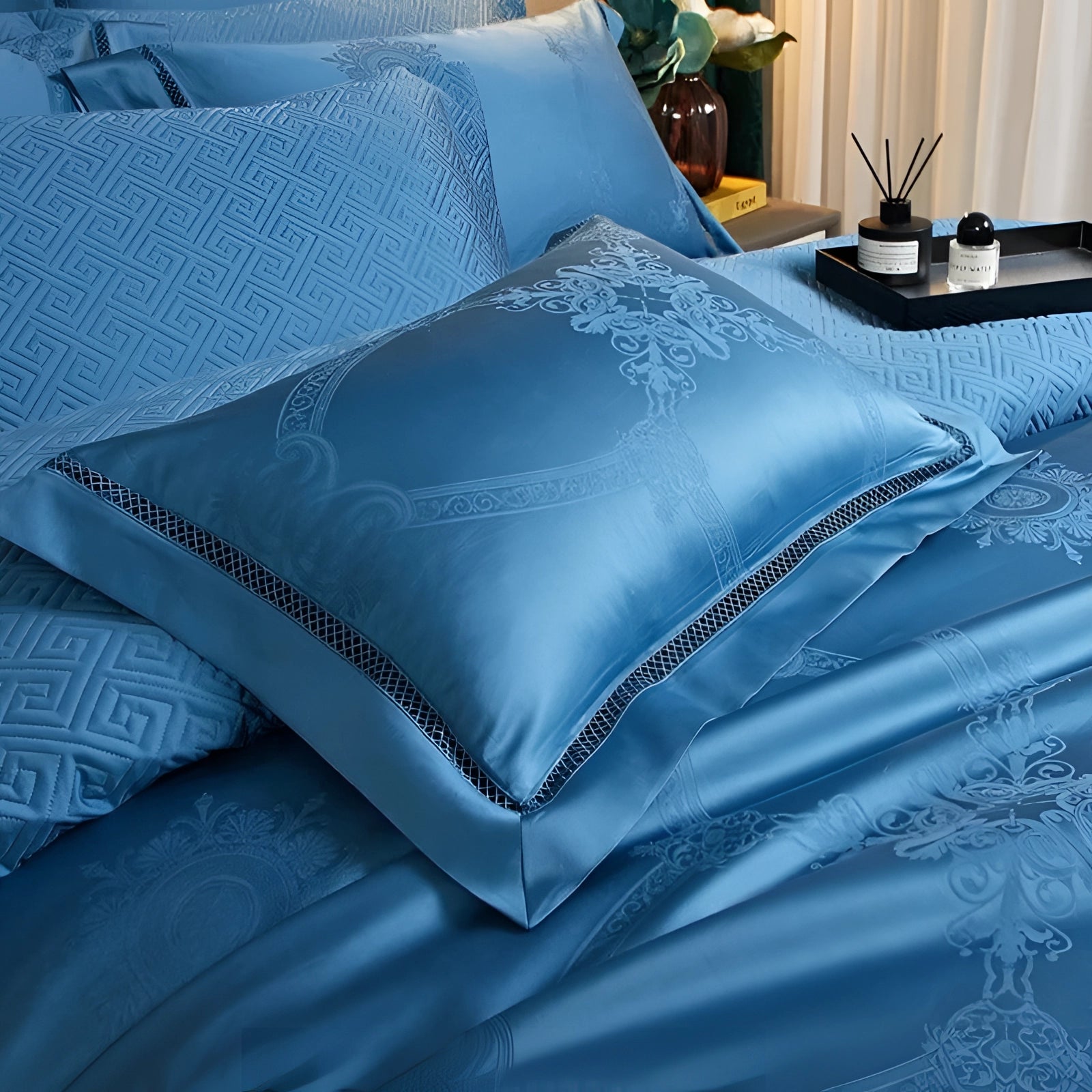 Blue king size silk bedsheet set displayed on a neatly made bed, showcasing its luxurious and wrinkle-free texture. The set includes matching pillowcases, all in a rich azure hue, enhancing the bedroom's comfort and elegance.