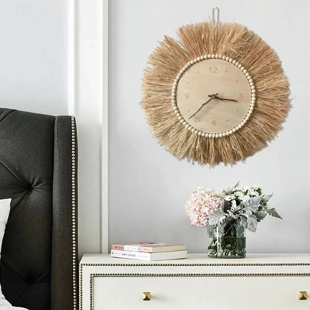 Handcrafted Boho tassel wall clock with a rectangular wooden frame, featuring grey tones and fringe details, displayed on a wall alongside shelving, enhancing interior design with its quartz clock functionality.