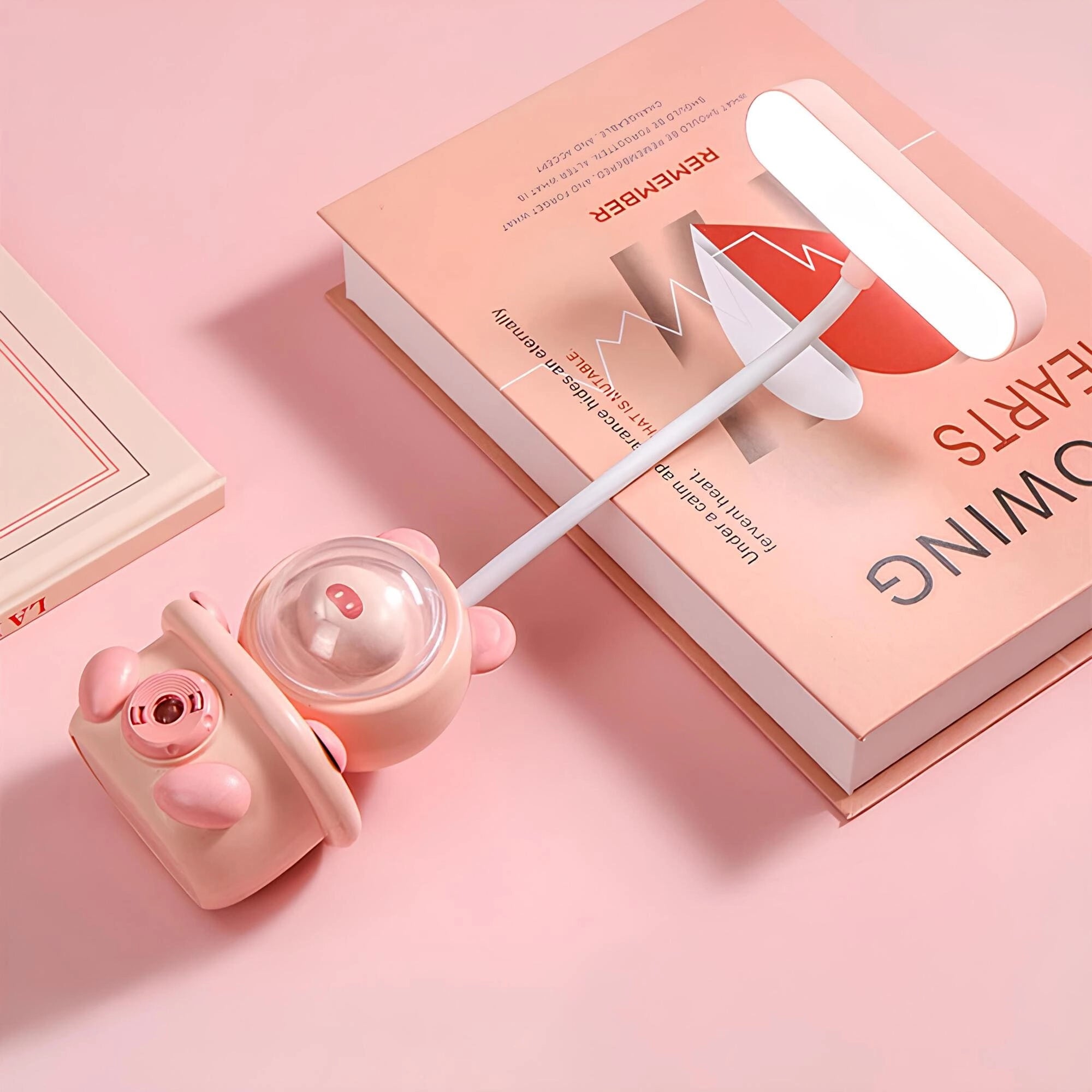 Cartoon Bunny LED desk lamp with touch control and USB rechargeable feature, featuring a cute bunny design in shades of magenta and peach.