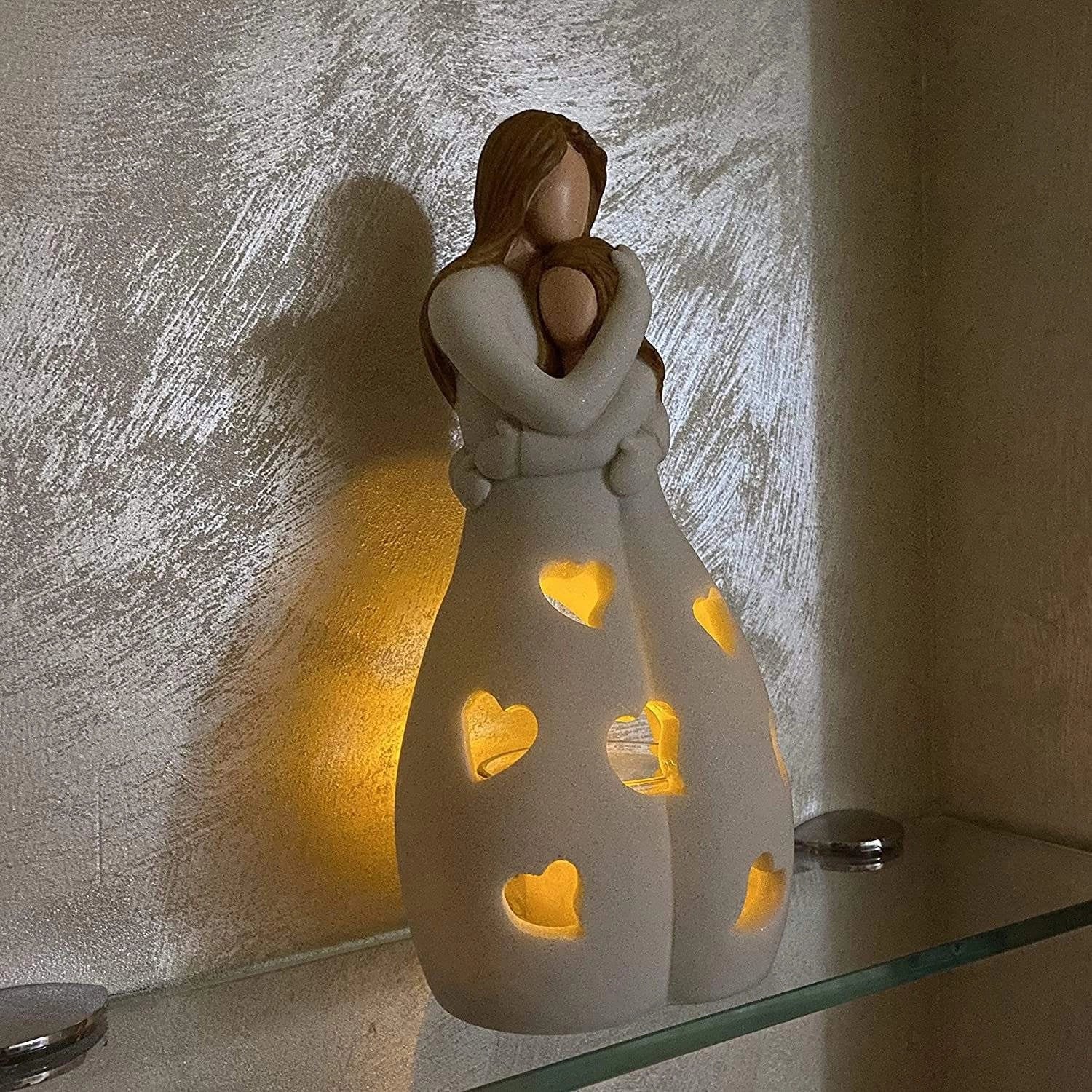 Ceramic love lamp with heart pattern, emitting a warm glow, designed as a romantic night light for couples, placed in a cozy room setting.