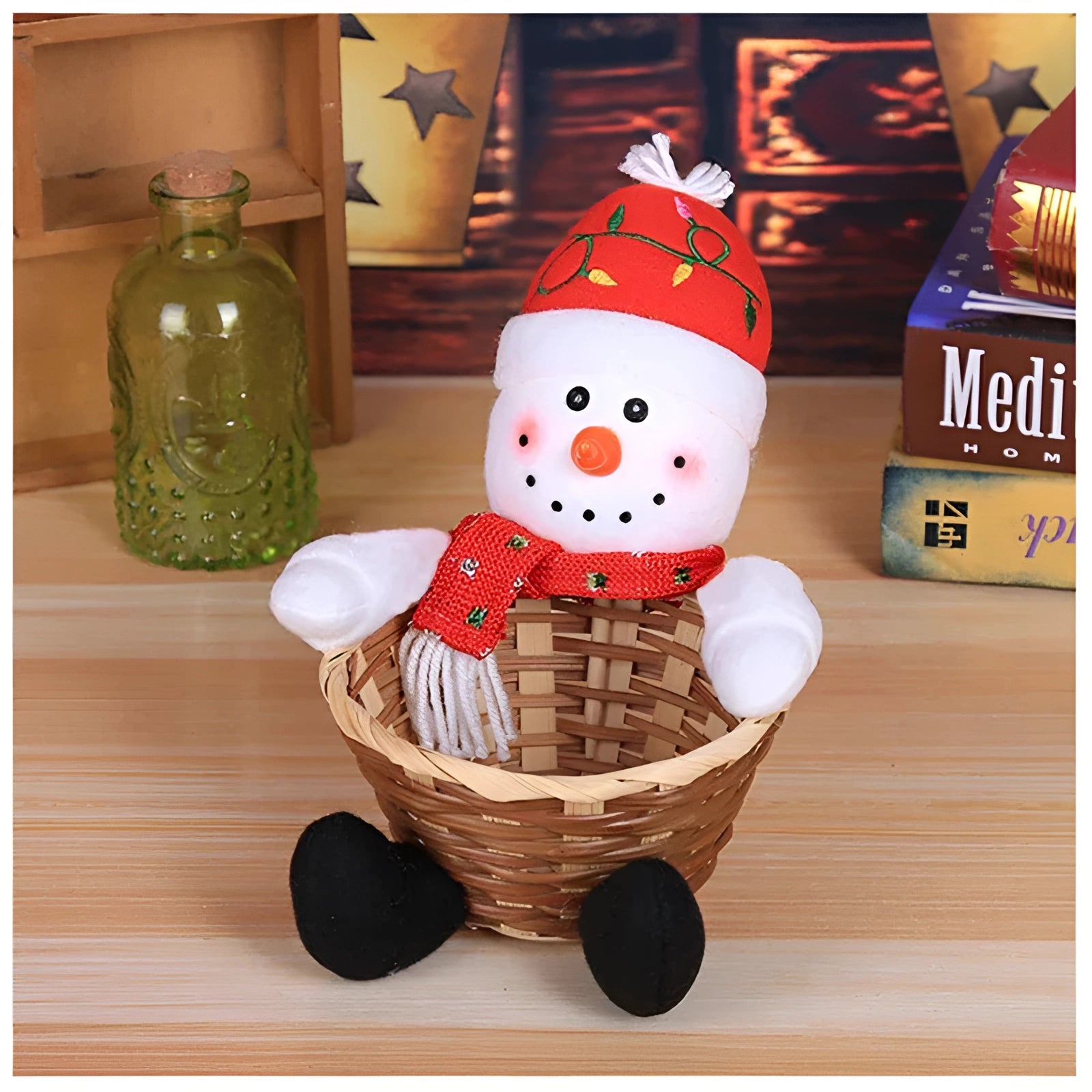 A festive gift basket featuring a gingerbread man plush toy and snowman-themed kitchen decor, including a snowman figure with a costume hat. The basket is made of wood and designed for storage or as a decorative piece, complementing holiday-themed serveware and drinkware.