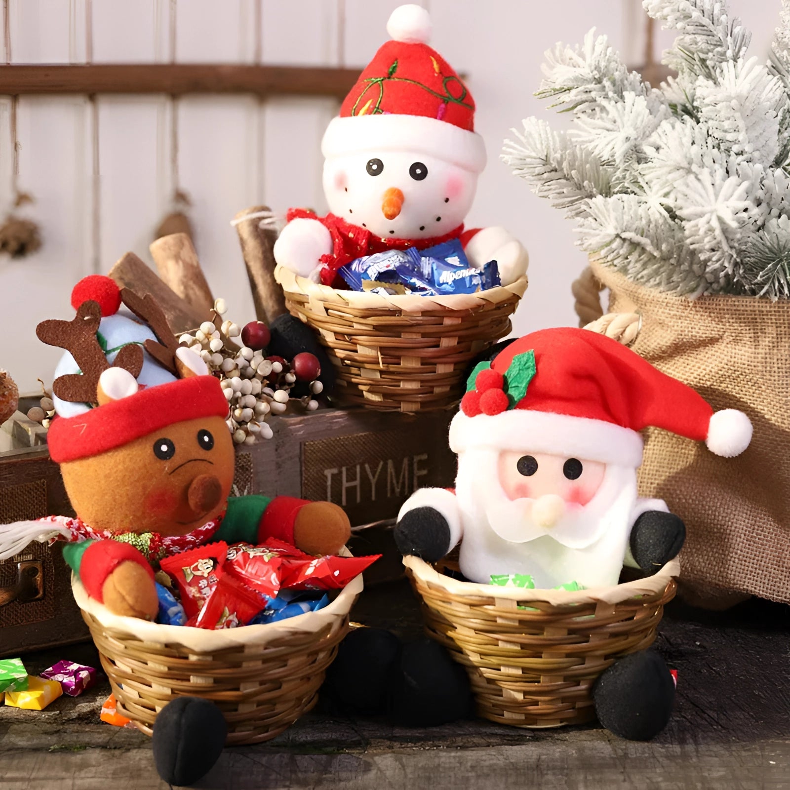 Gingerbread man plush toy wearing a festive hat, nestled in a decorative gift basket filled with holiday-themed kitchen ornaments.