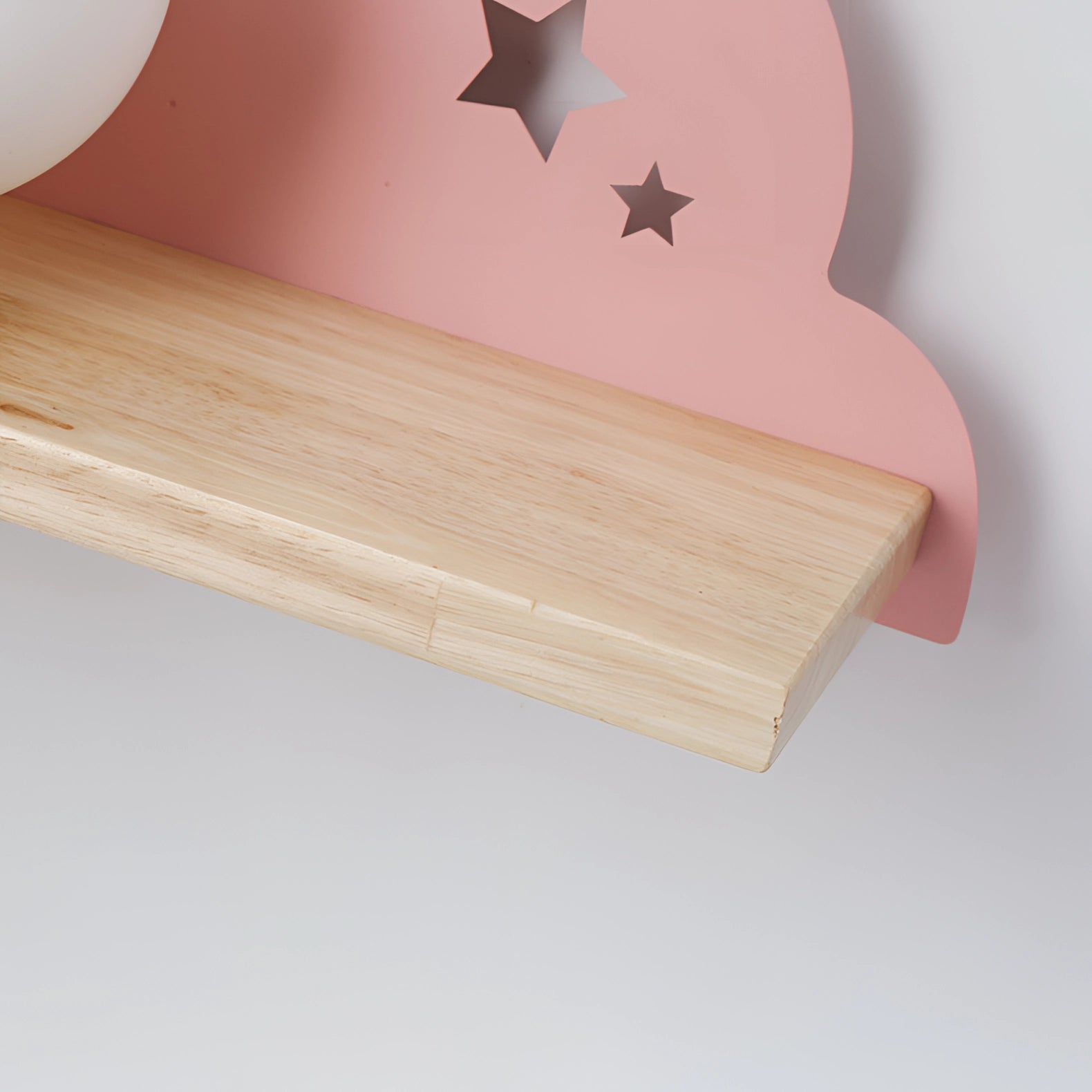 A wooden cloud-shaped LED wall lamp designed for children's rooms, featuring a star cut-out and a soft, warm glow.