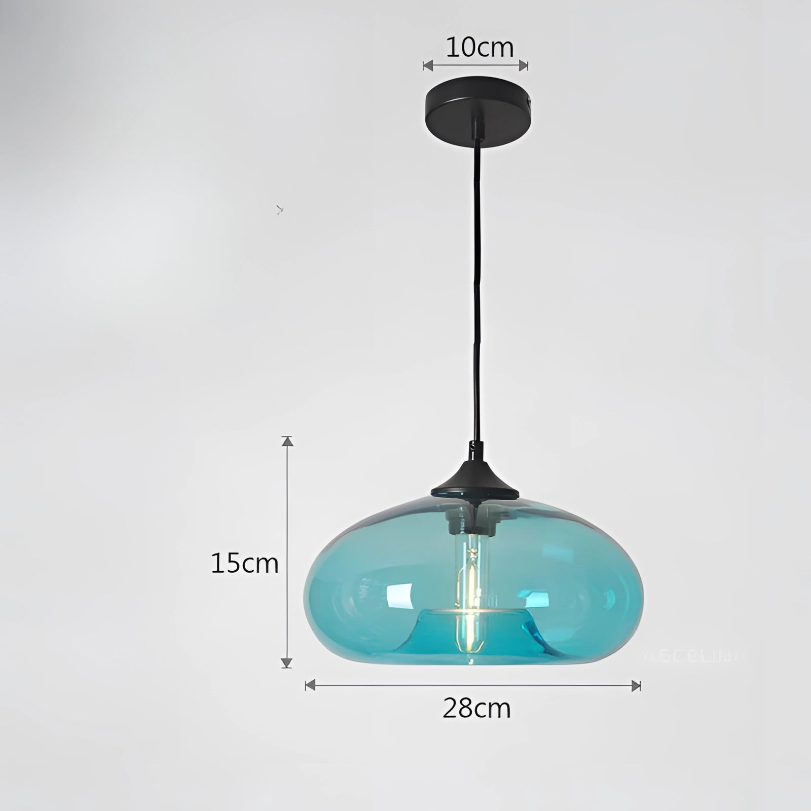 Colorful glass pendant lights in a modern mid-century style, featuring a blue shade with a warm white glow, suspended from the ceiling.
