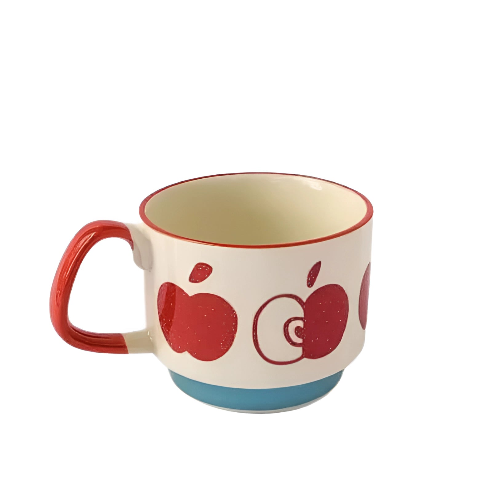 Colorful polka dot ceramic mug with red handle and blue base, featuring a red apple design.