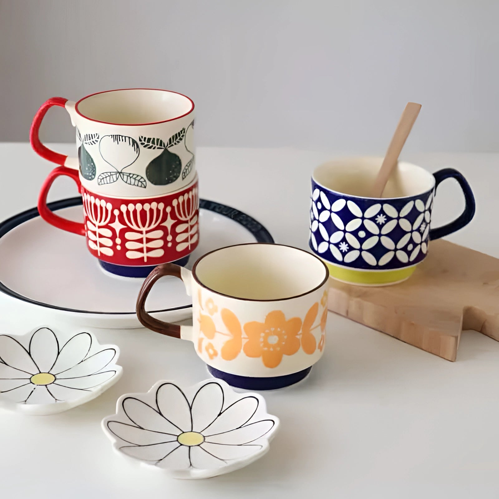 Colorful polka dot ceramic mug featuring a red handle and blue base, suitable for serving coffee or tea, with a vibrant and playful design ideal for tableware and drinkware collections.