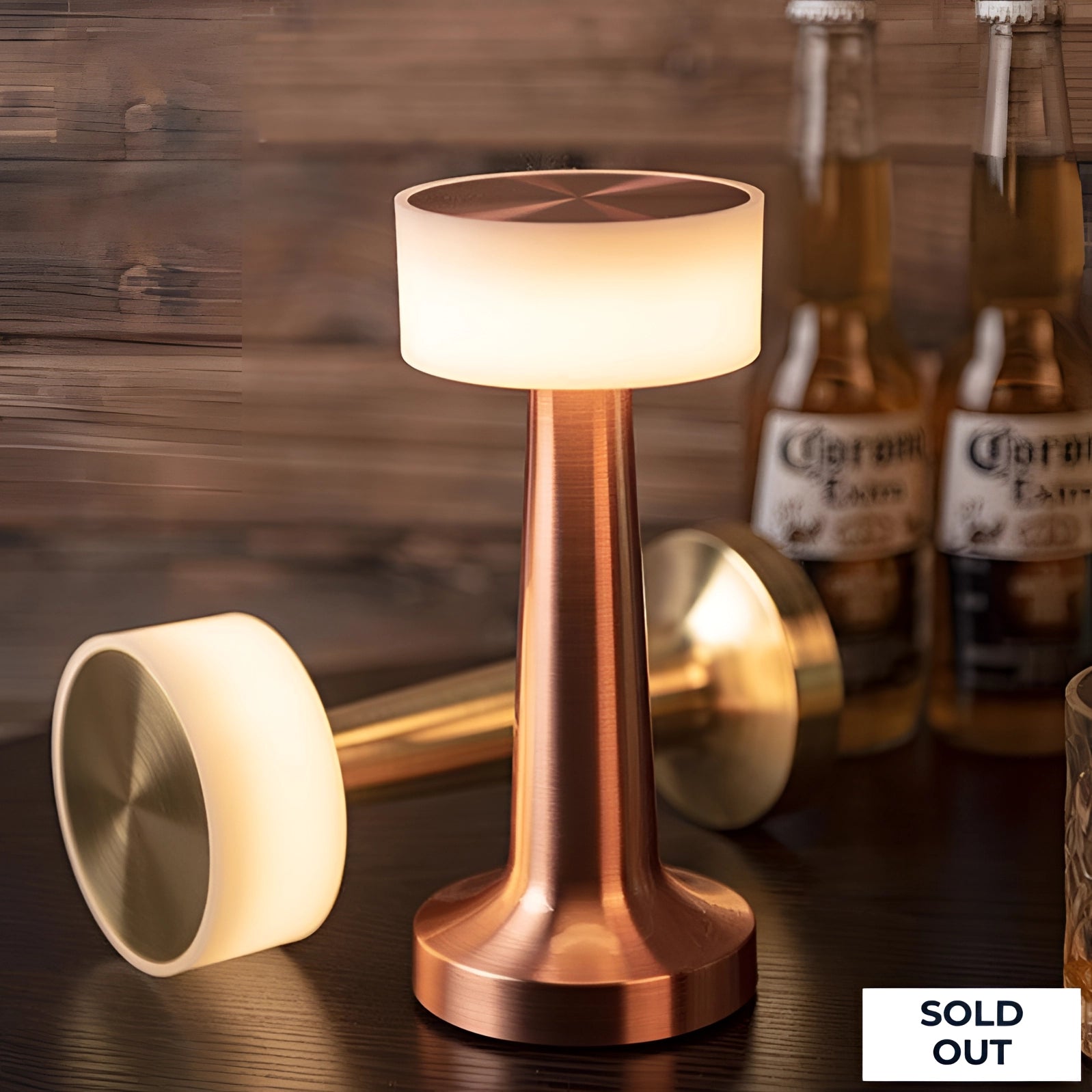 Modern Copper LED Table Lamp with Frosted Glass, Rechargeable and Touch Control, placed on a wooden table.