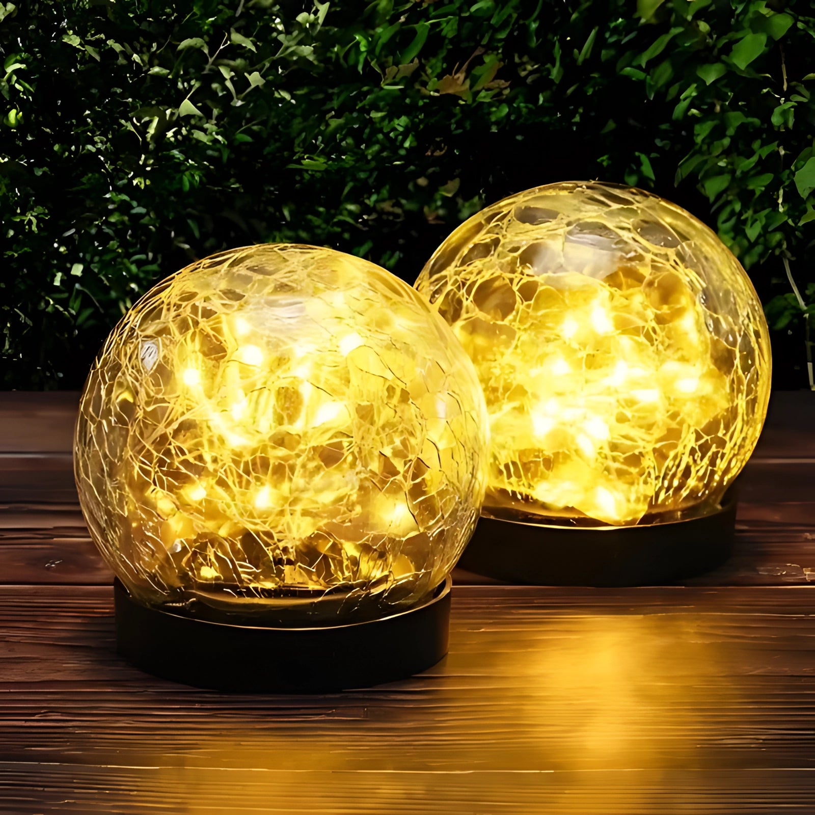 Crackled glass solar light in globe shape, featuring a yellow tint, designed for outdoor use on patios, resembling a decorative yard globe or Christmas ornament.