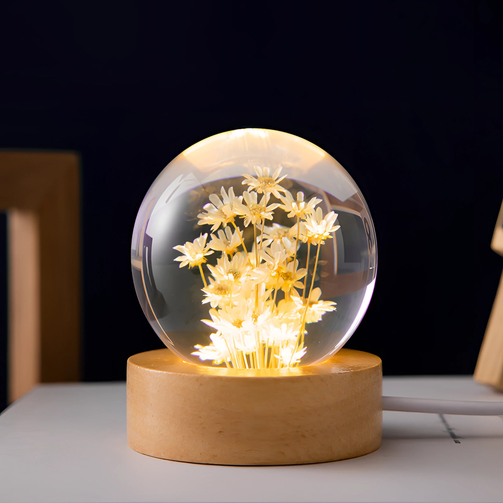 Dandelion resin lamp featuring a preserved yellow daisy encased in a clear circular design, set on an LED wooden base, resembling a unique botanical night light.