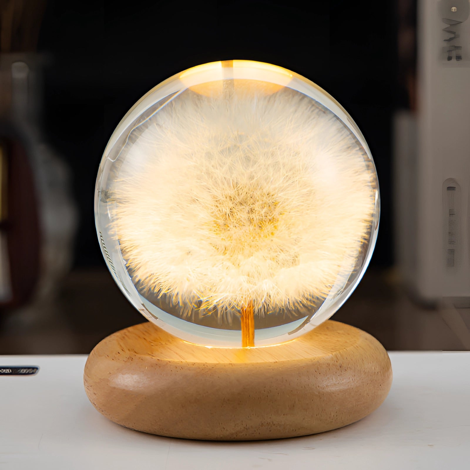 Dandelion Resin Lamp with LED Wooden Base showcasing a preserved dandelion encased in clear resin, featuring a round design and natural wood base, providing a unique botanical night light effect.