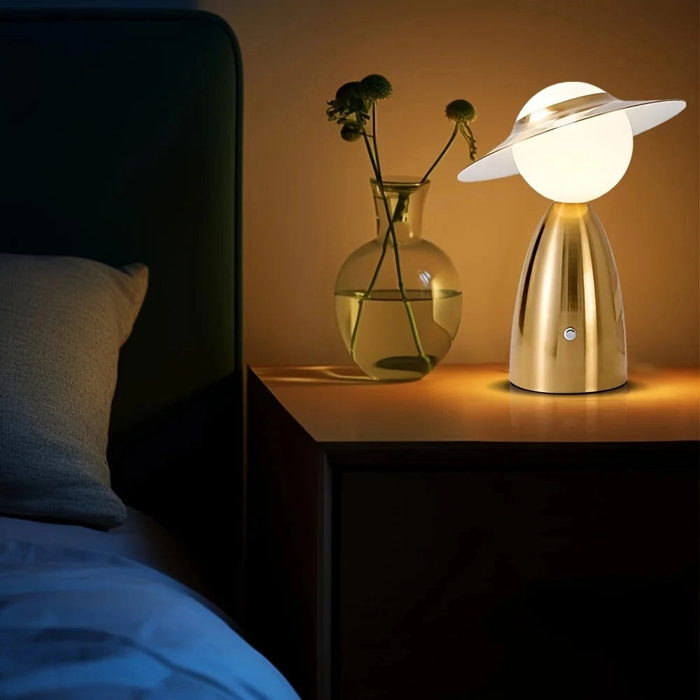 Modern UFO-shaped designer mushroom lamp with a wooden base, emitting a warm yellow light, perfect for artistic bedside lighting or contemporary interior design.