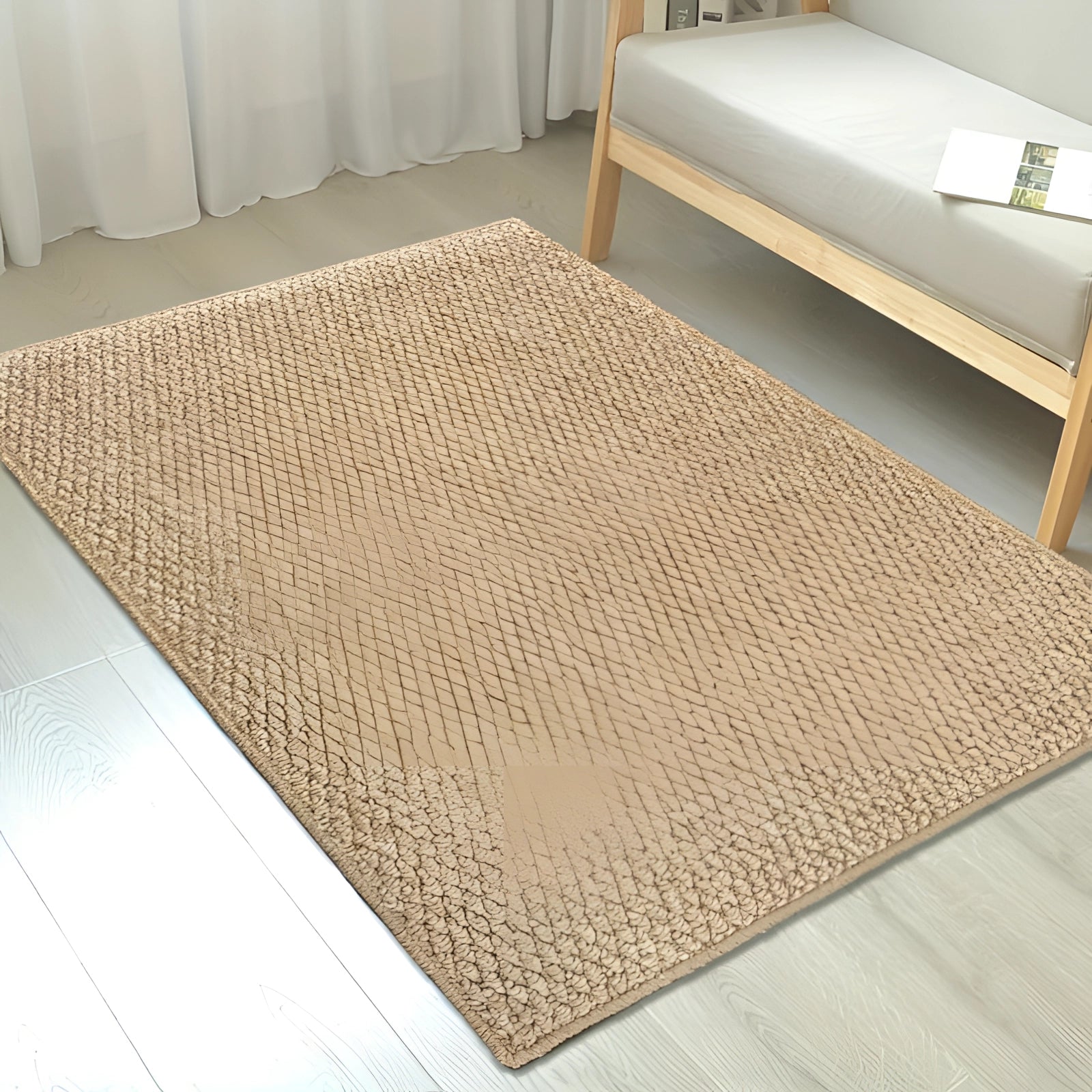 Beige rectangular indoor doormat placed on a hardwood floor near a door.