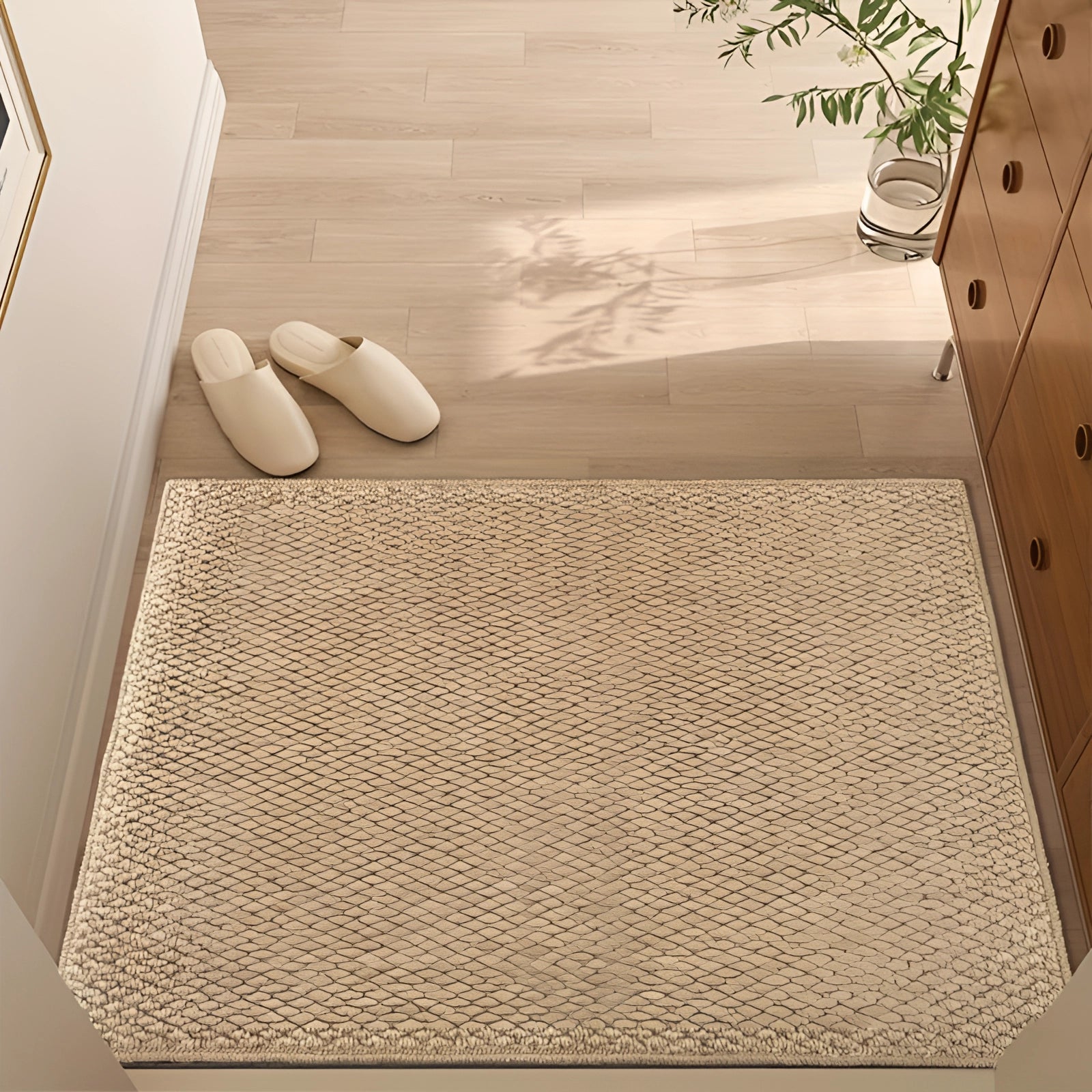 Eco-friendly beige indoor doormat in a large size, featuring a rectangular shape and non-slip backing, displayed on a hardwood floor setting.