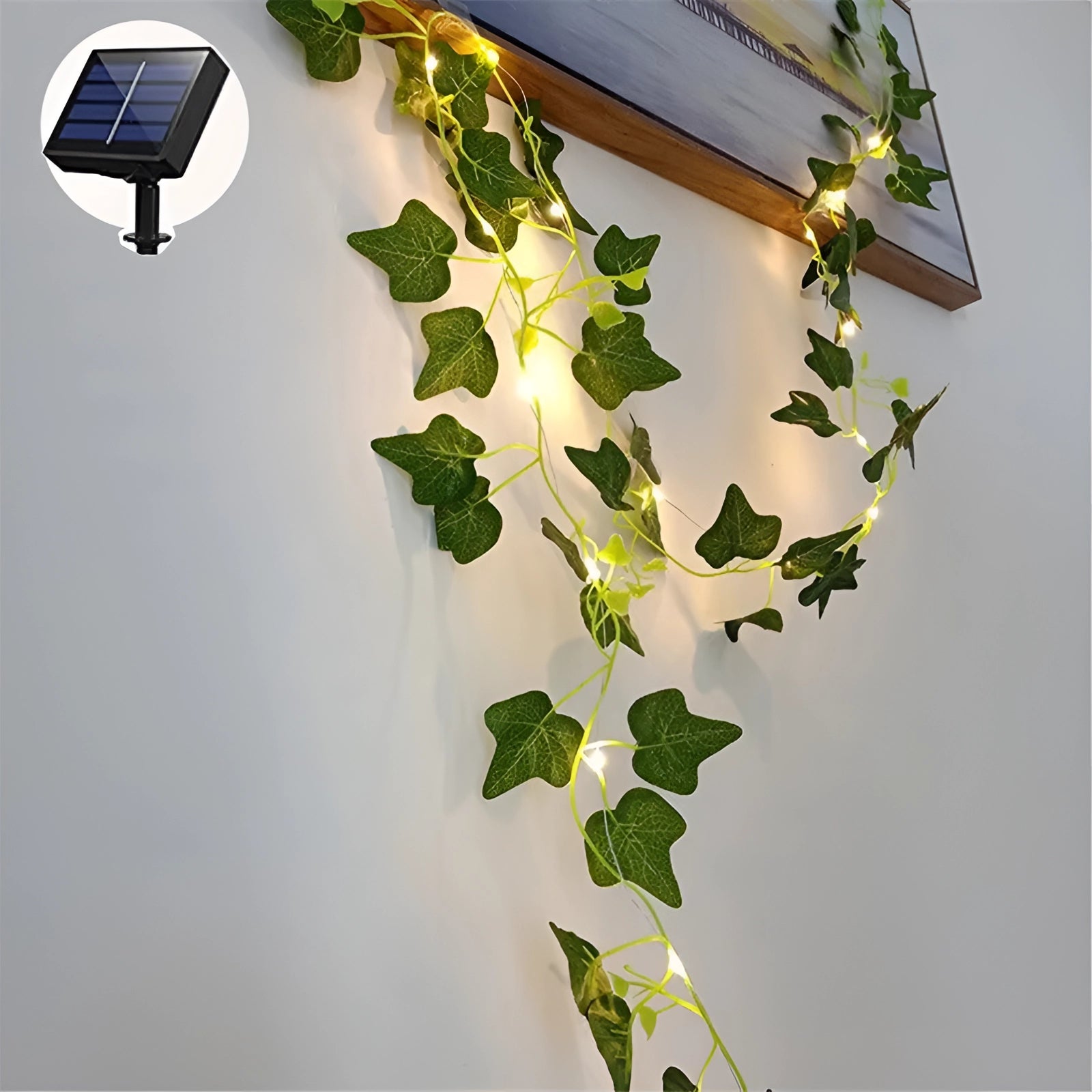 Eco-friendly LED ivy fairy lights featuring maple leaf designs, measuring 10 meters in length with 100 LEDs, displayed in a creative arrangement resembling a vine with illuminated leaves.