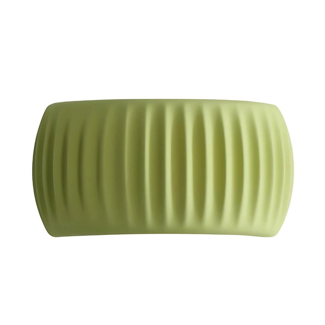 A green eco-friendly textured foam roller designed for muscle recovery therapy, showcasing its cylindrical shape and textured surface against a plain background.