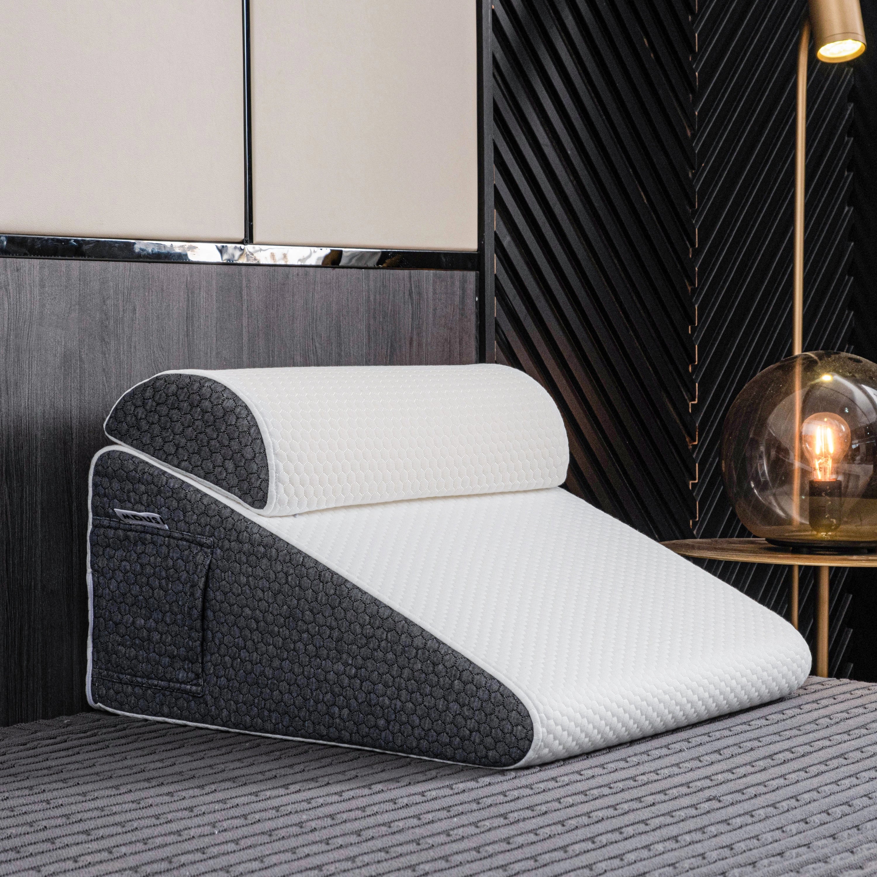 Ergonomic memory foam neck support pillow with a rectangular shape, designed for optimal comfort and support, shown on a wooden floor in a well-lit interior setting.