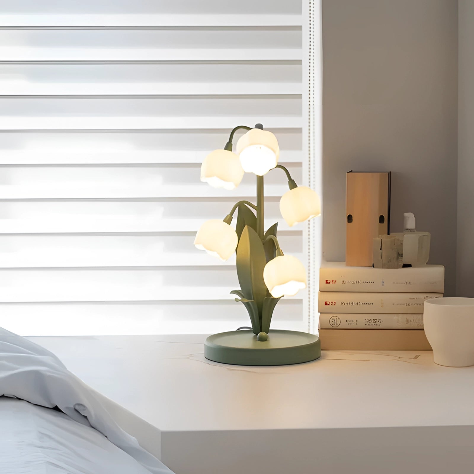 Floral Tulip Table Lamp with a nature-inspired design featuring a wooden base, textile shade, and LED light, styled in an interior setting with houseplants.