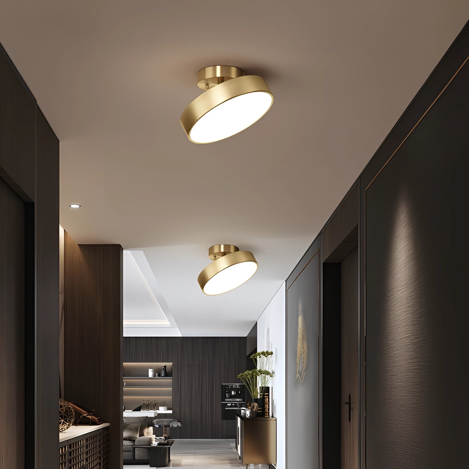 Modern minimalist circular gold LED flush mount ceiling light installed in a stylish interior space with wooden accents and houseplants.