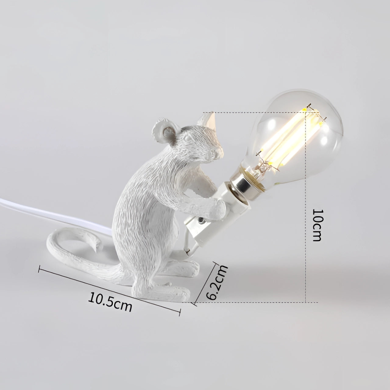 A gold mouse-shaped lamp with intricate details, designed as a quirky animal-themed desk light, providing an eccentric and stylish touch to home decor.