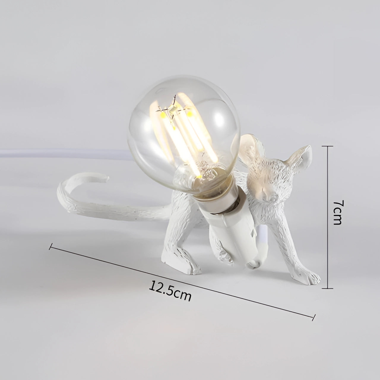 Gold mouse-shaped desk lamp with a quirky and eccentric design, featuring a whimsical animal figure holding a light bulb, ideal for unique home decor or as a conversation-starting desk accessory.