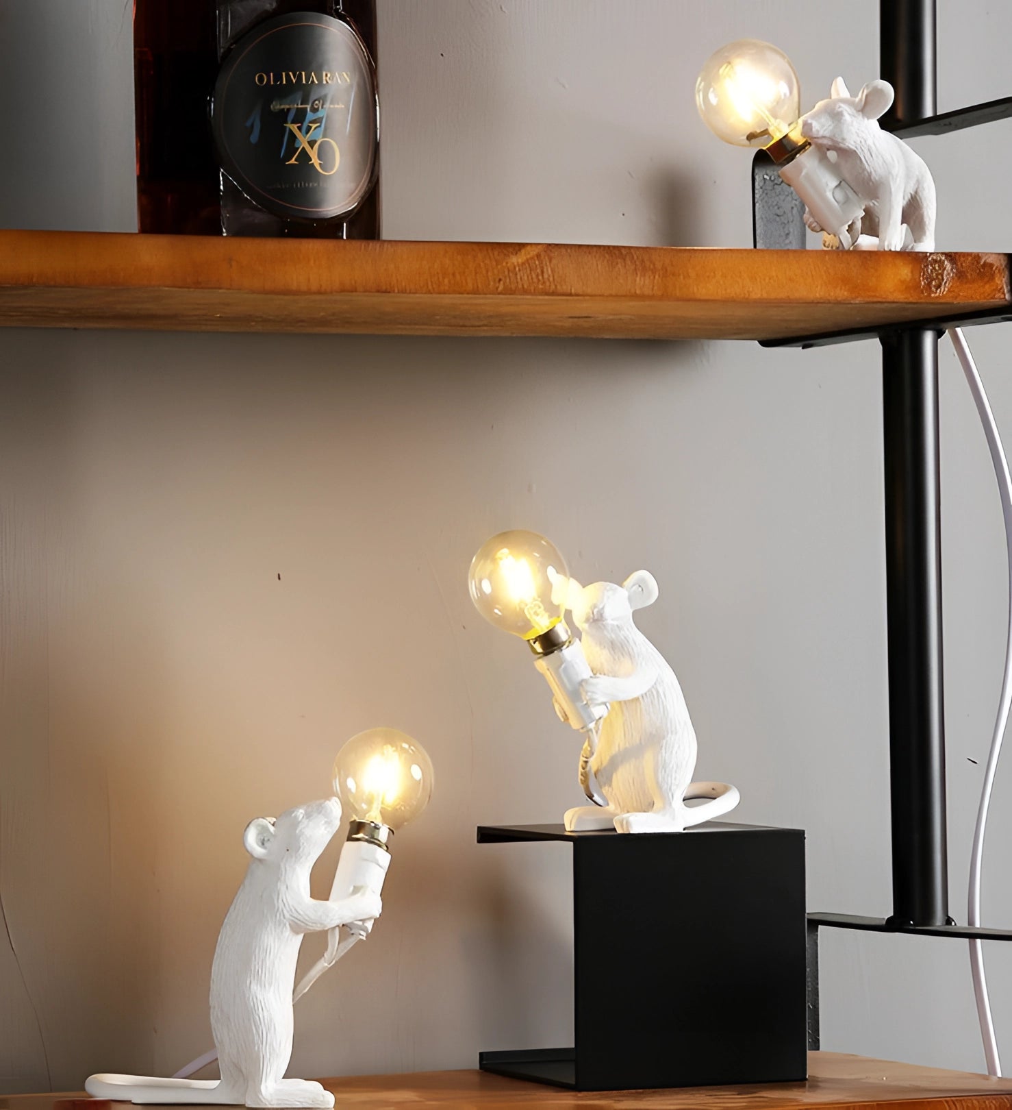 A whimsical gold mouse-shaped lamp designed as a quirky desk light, featuring intricate mammal details and casting a warm glow, perfect as eccentric decor for a shelf or interior design accent.