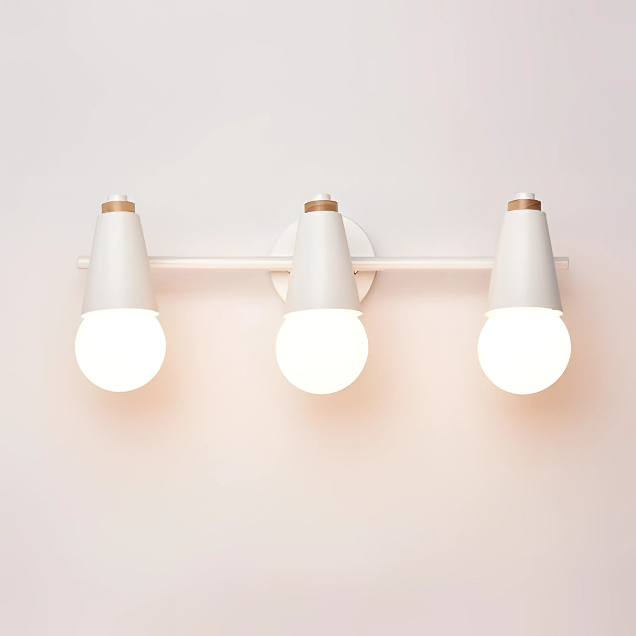 Modern Green Triple Pendant light fixture with three white energy-efficient bulbs hanging from the ceiling, showcasing Scandinavian design.