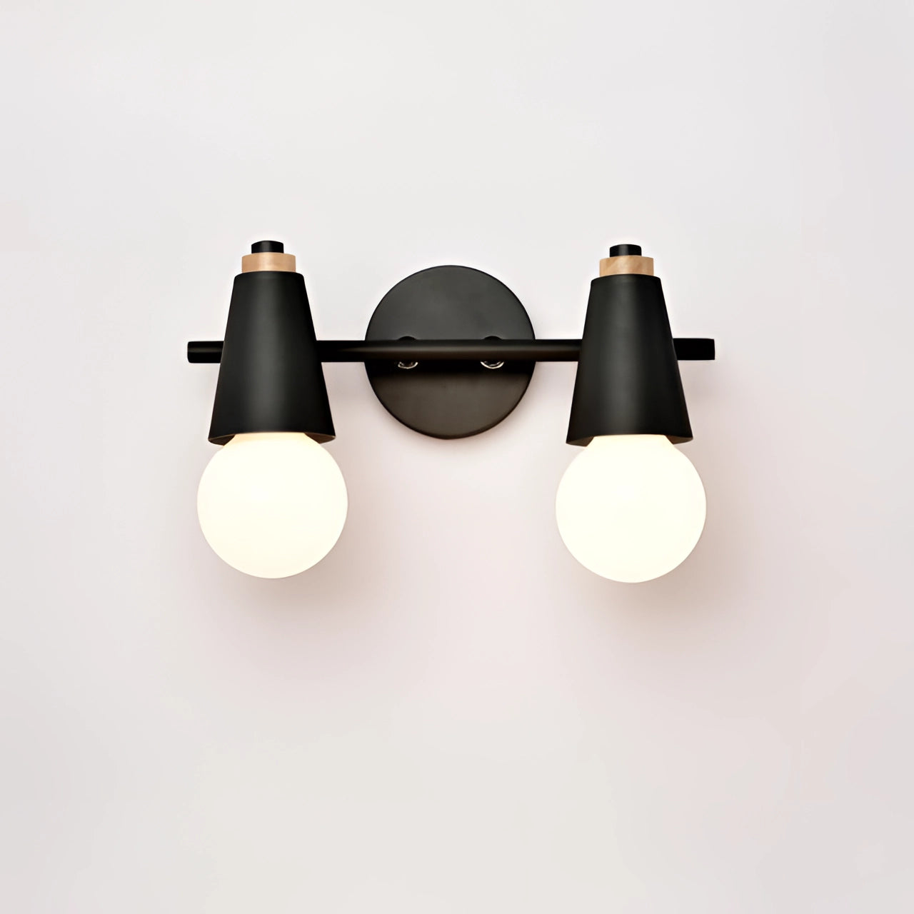 Modern Scandinavian Green Triple Pendant Light with 2 Black Lamps hanging from the ceiling over a table.