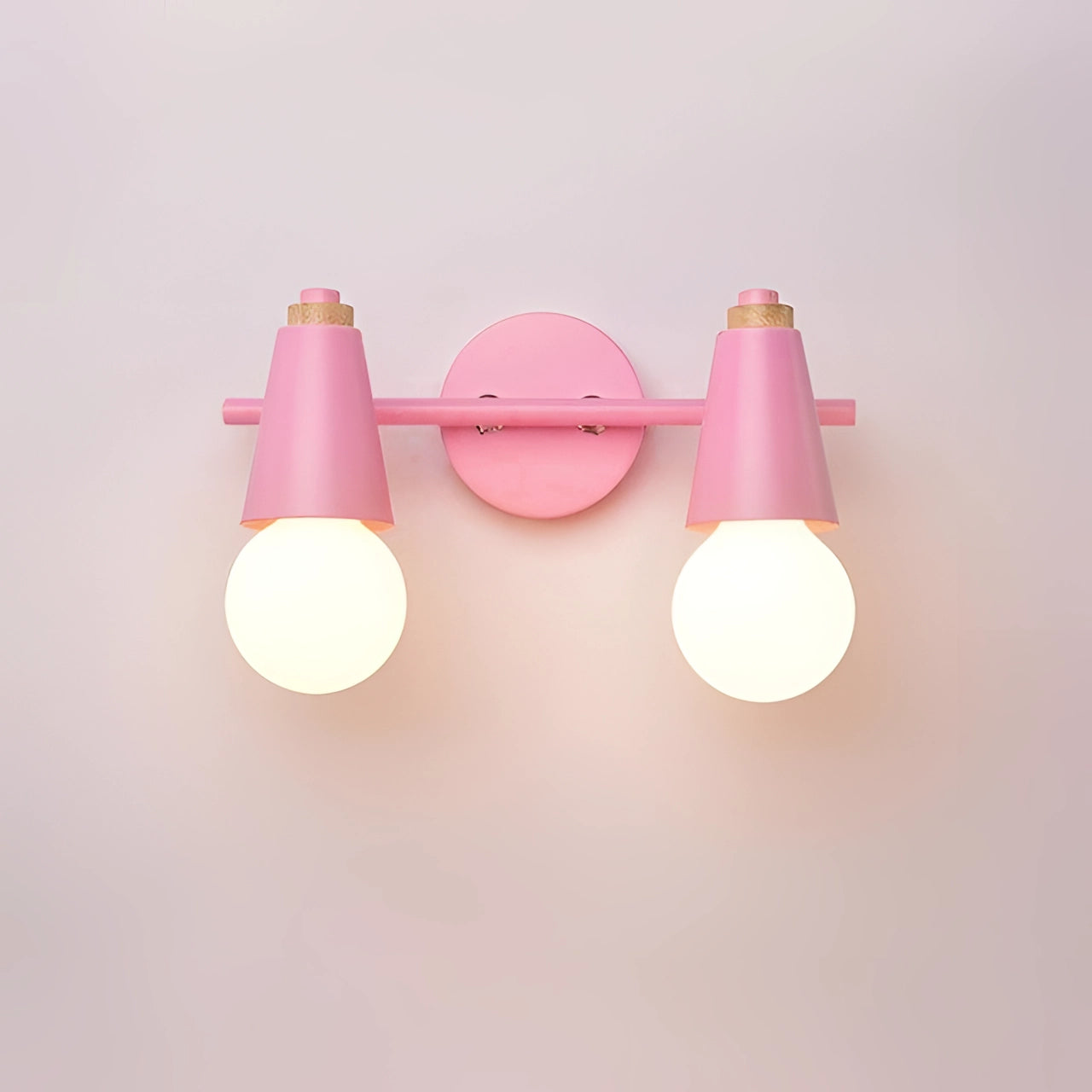 Modern Scandinavian lighting featuring a green triple pendant design with two pink lights, energy-efficient hanging lampshades.
