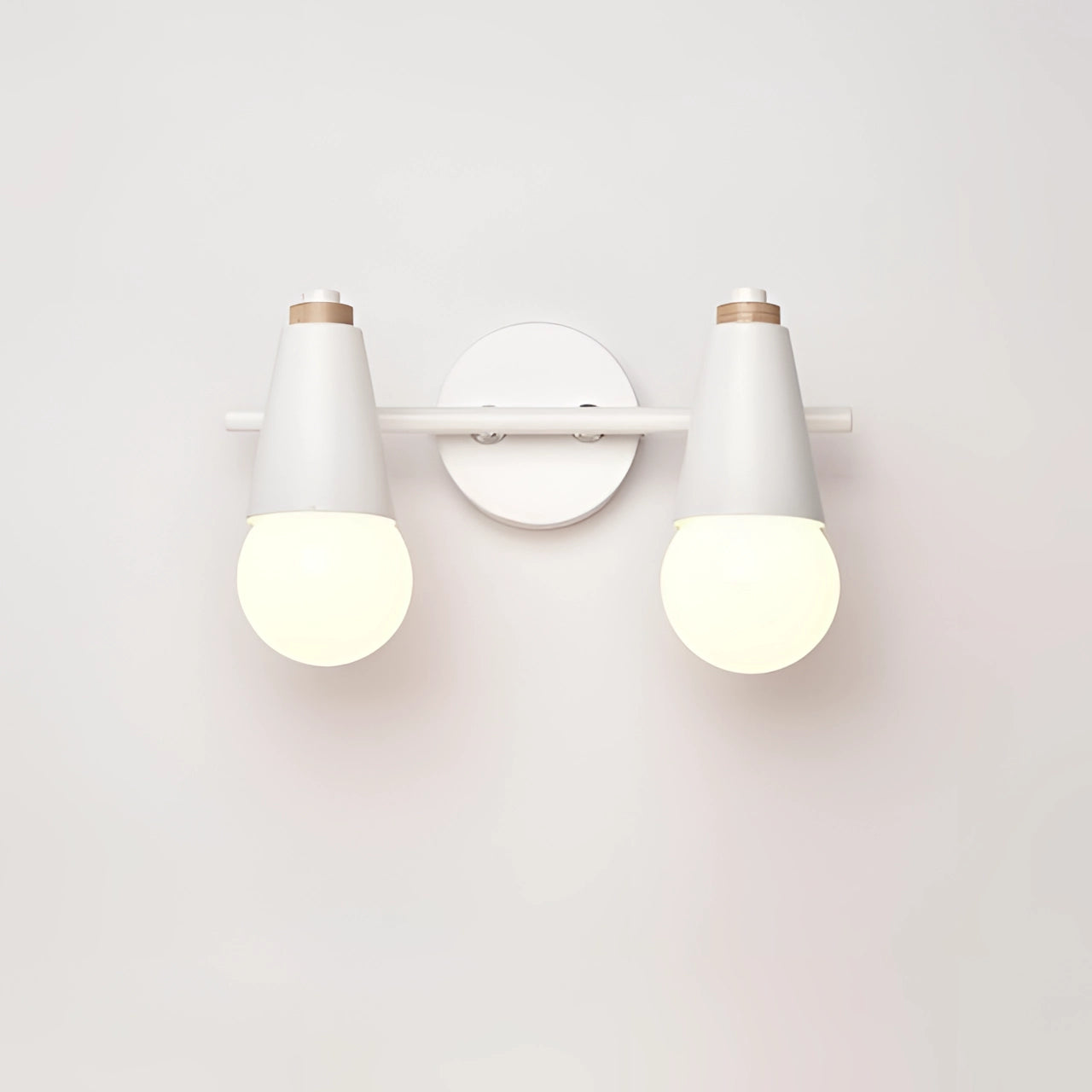 Modern Scandinavian green triple pendant light with wood accents, featuring two white circular energy-efficient light fixtures suspended from the ceiling.