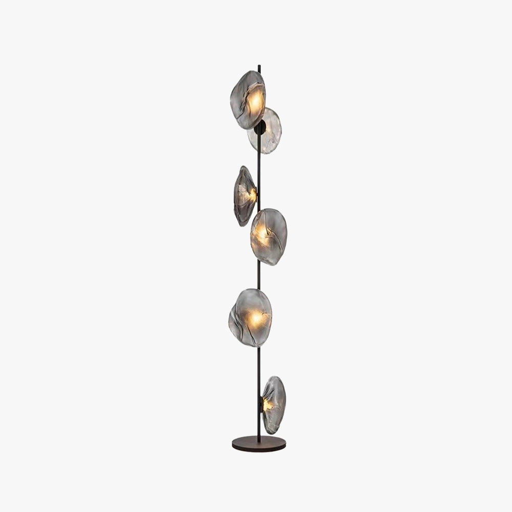 Industrial metallic pebble floor lamp with a sculptural design and artistic lighting elements, featuring a sleek metallic finish and pebble-shaped components.