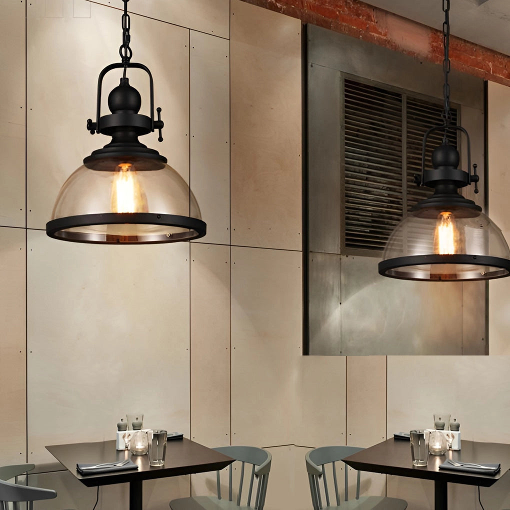 Industrial pendant lights with a rustic design, featuring exposed Edison bulbs, hanging above a wooden table in a stylish interior setting.
