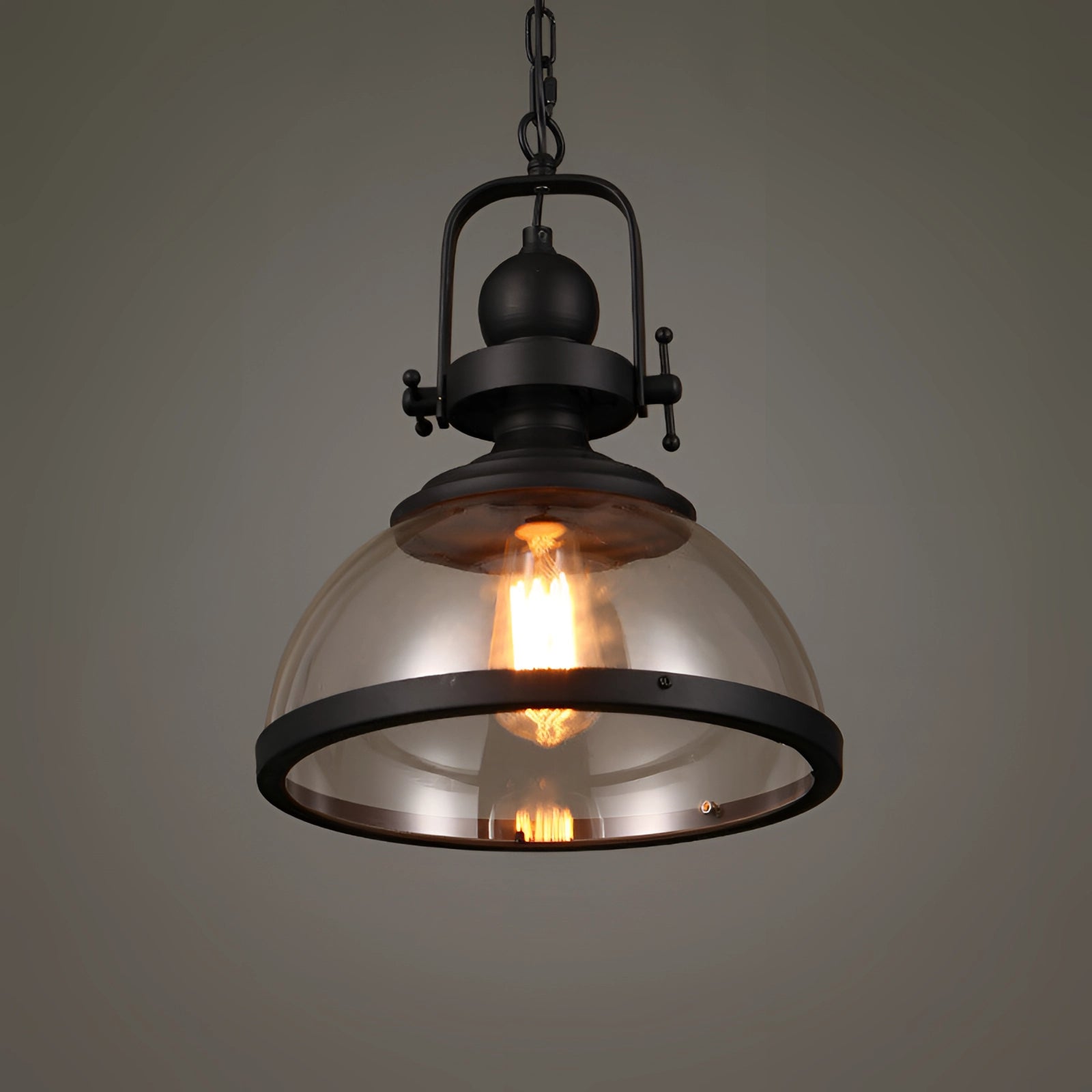 Industrial pendant light featuring a rustic design with exposed Edison bulb, metal and wood elements, and glass ceiling fixture.