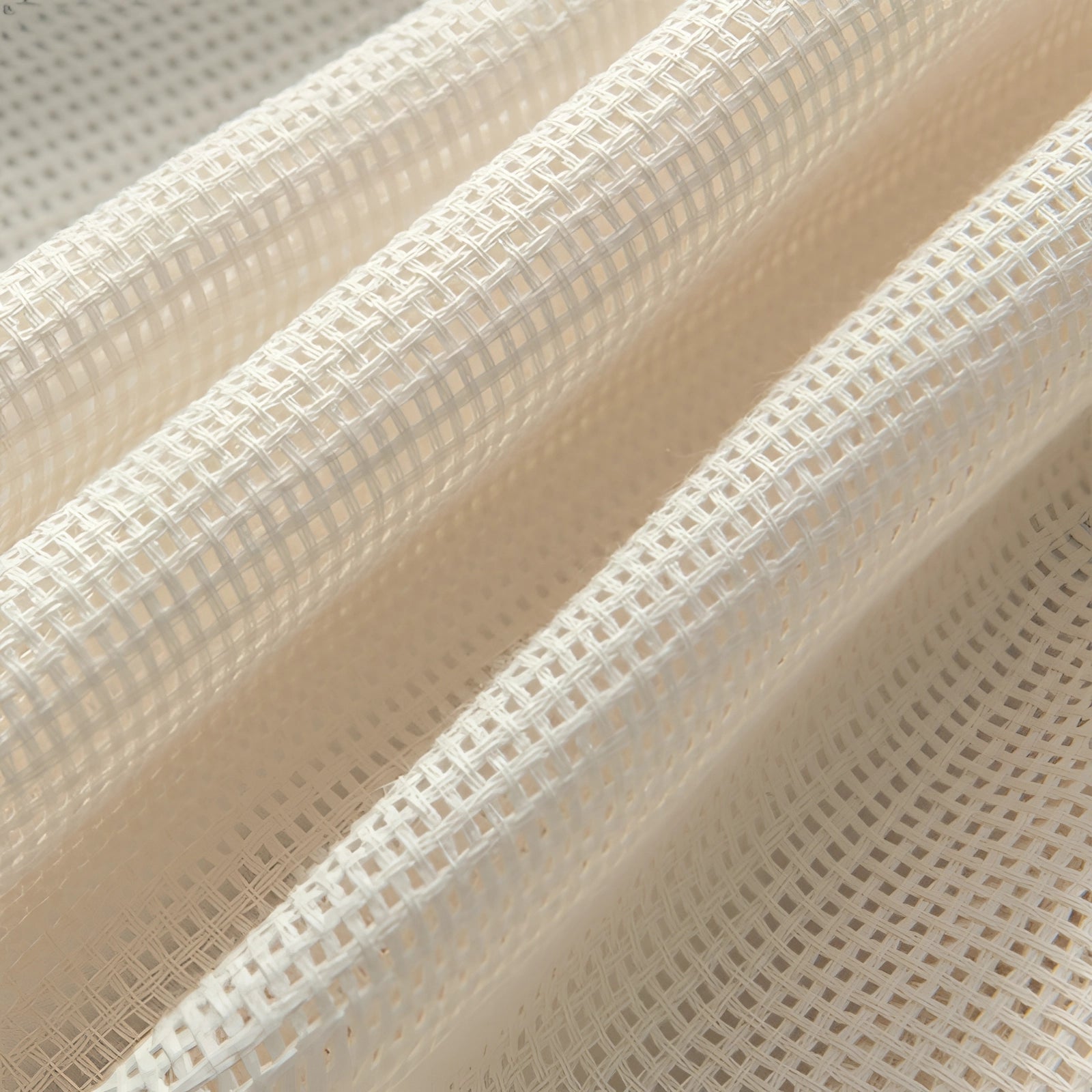 Ivory sheer curtains with an elegant linen texture, designed for living rooms and doors, featuring a soft beige color and subtle pattern, hanging gracefully.